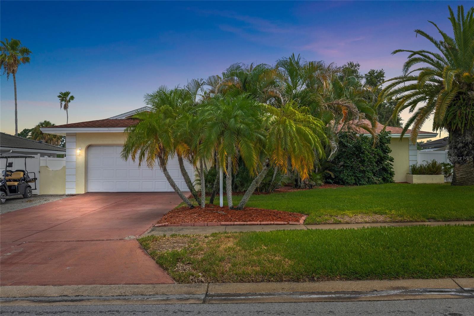 Welcome to the perfect blend of style, comfort, and location in one of Dunedin's most sought-after neighborhoods—Pinehurst Highlands! This beautifully renovated 3-bedroom, 2-bathroom pool home offers an ideal layout for Modern Florida Living. The stunning remodeled kitchen features elegant marble countertops, shaker cabinetry, stainless steel appliances, abundant storage, and a built-in office workspace overlooking the screened Rear Patio and sparkling pool. Designed with both everyday living and entertaining in mind, the home also offers a spacious living room, separate family room with a cozy wood-burning fireplace, and a dedicated dining area. The split-bedroom floor plan provides added privacy, with a generous primary suite featuring a walk-in closet and beautifully updated ensuite bathroom. Additional highlights include impact windows (2021), a remodeled kitchen with new appliances (2021), new blown attic insulation (2025), new water heater (2025), updated electrical panel and shell parking pad for a 3rd vehicle, Boat, RV, etc. Located in a non-flood zone and within Dunedin's golf cart district, you'll enjoy direct access to nearly 100-acre Hammock Park at the end of the street and be just minutes from top-rated schools, vibrant downtown Dunedin, the Recreation and Aquatic Centers, Splash Park, Dunedin Golf Club, Highlander Park, the Pinellas Trail, baseball fields, tennis and pickleball courts, the Public Library, and TD Ballpark, home of Blue Jays Spring Training. Move-in ready and perfectly located—it's easy to see why homes in Pinehurst Highlands don't stay on the market for long!