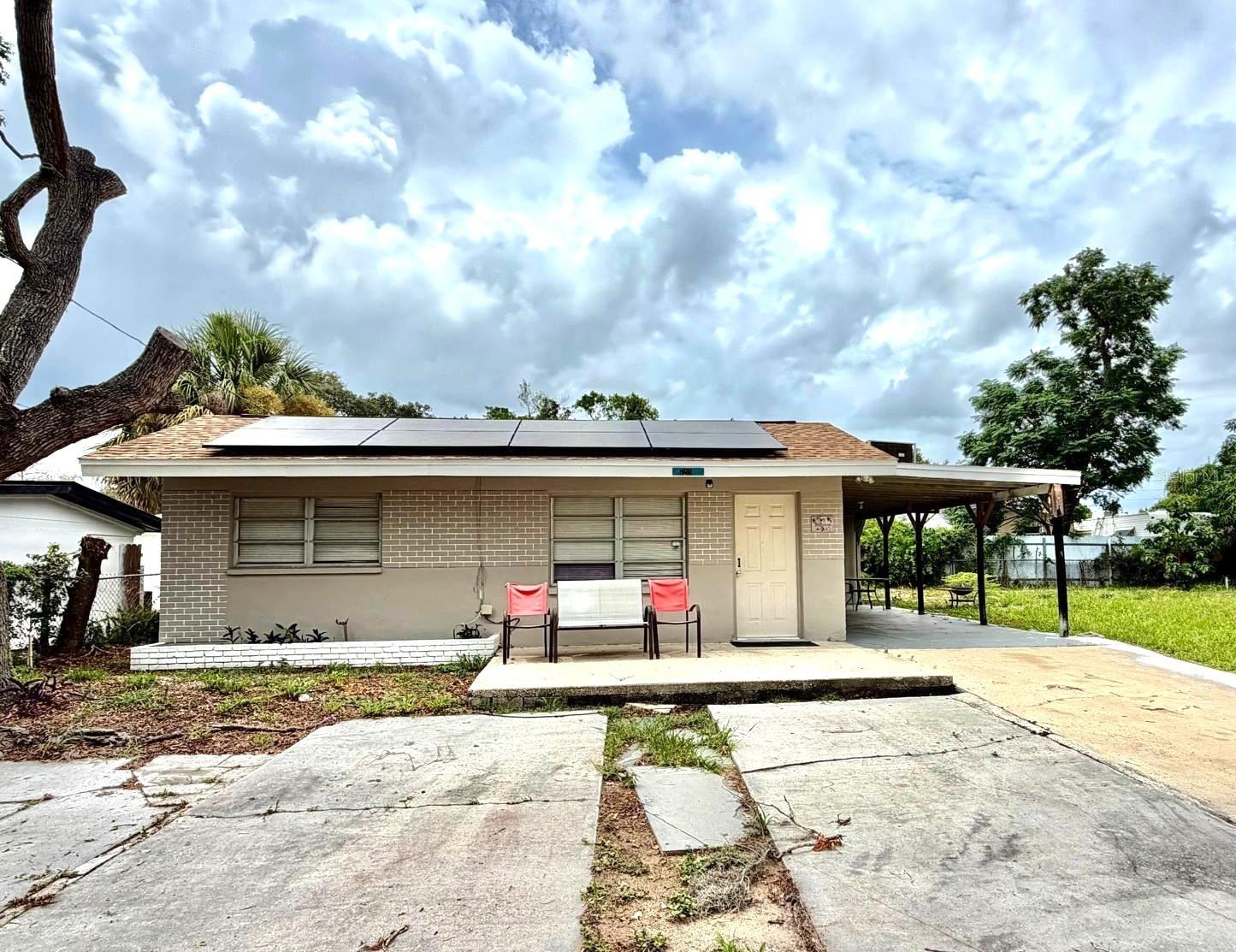 Charming 2-bedroom, 1-bath home located on a quiet cul-de-sac in Port Richey. Spacious fenced yard. Covered carport and a convenient outdoor laundry area. Water Included. Solar panels help keep your monthly electric bill low. Conveniently situated just minutes from US-19, shopping, restaurants, schools, and everyday amenities. Don't miss this great rental opportunity in a convenient location. Pets are welcome, subject to size restrictions and approval. Schedule your showing today!