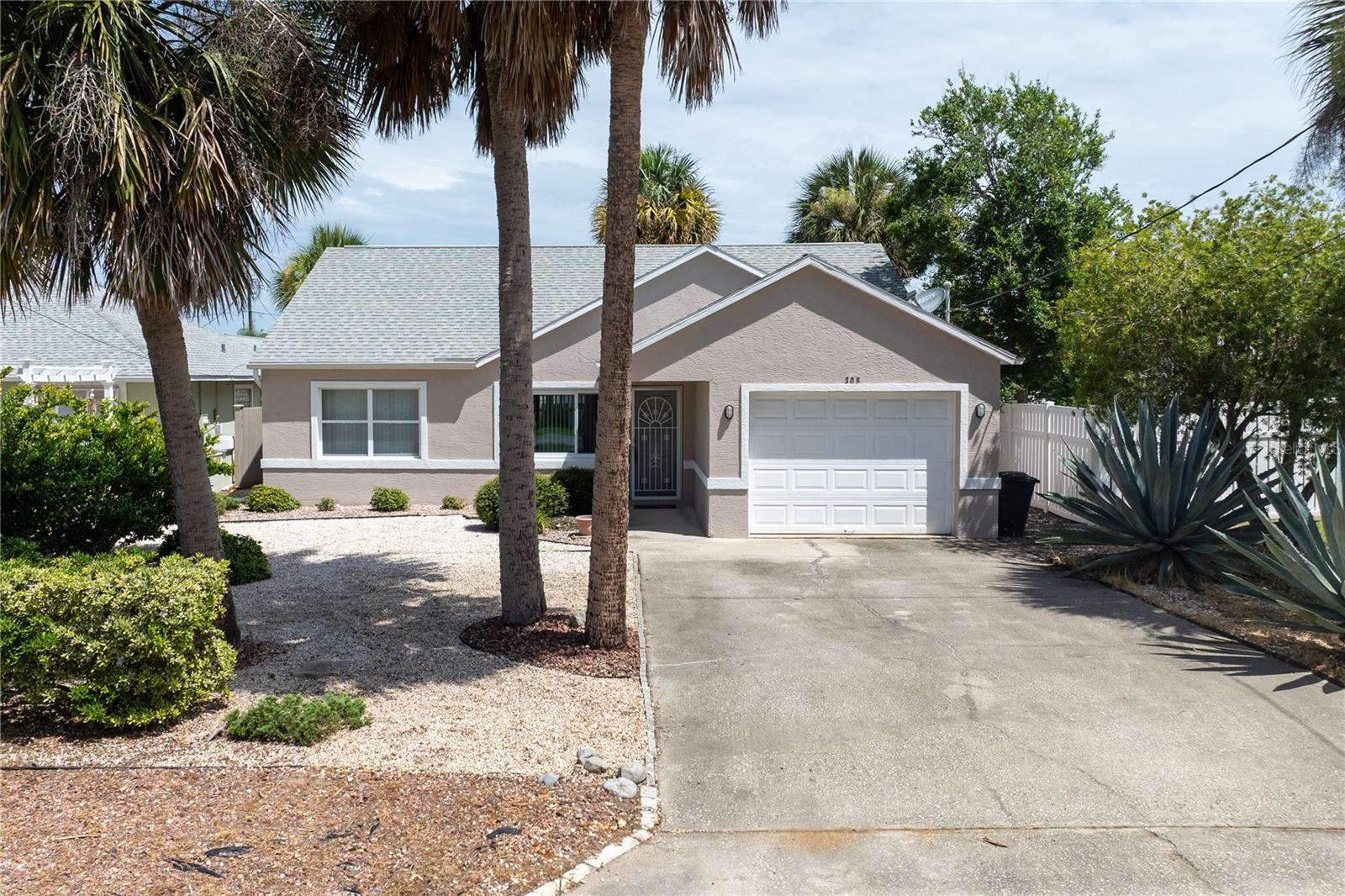 Perfectly situated just a couple of blocks from the ocean in the heart of Flagler Beach, this charming coastal home offers the ideal blend of convenience and beachside living. Enjoy easy access to local restaurants, unique shops, and the area's beautiful no-drive beach, all just down the street.

Inside, the thoughtfully designed split floor plan features three bedrooms and two full bathrooms, providing privacy and flexibility for guests, a home office, or everyday living. Tile flooring runs throughout the main living areas, with comfortable carpet in the bedrooms. The low-maintenance xeriscape front yard enhances curb appeal while minimizing upkeep.

New roof in 2018. The fenced backyard creates a private outdoor retreat, while the glassed-in porch provides the perfect spot to relax and enjoy Florida evenings without getting bit. All information recorded in the MLS is intended to be accurate but cannot be guaranteed..