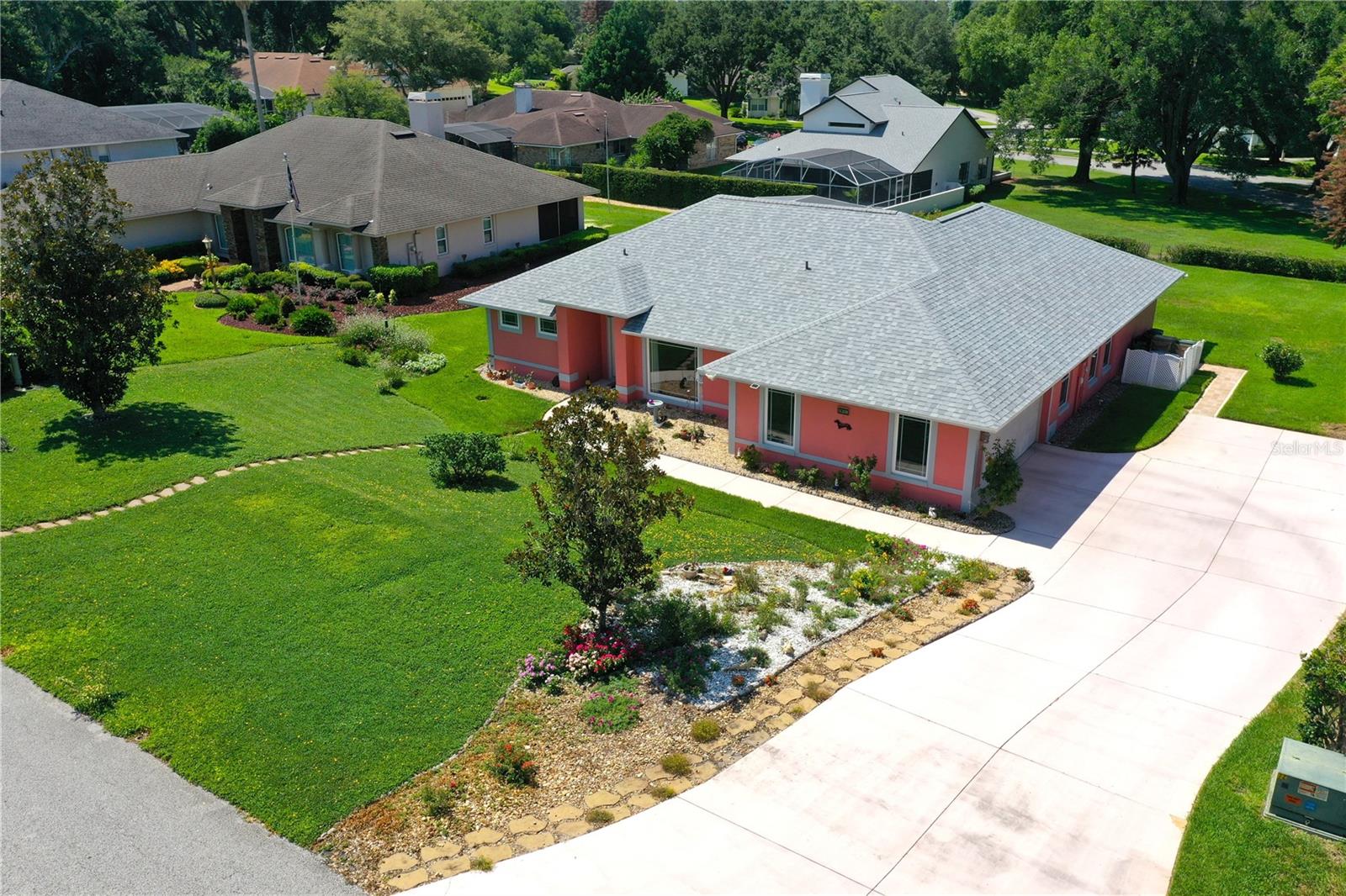 Welcome to 11208 Haskell Dr — a beautifully updated one-story pool home on a large 0.35-acre lot in a sought-after Clermont lake community. This 4-bedroom, 2-bath home offers 1,970 sq ft of bright, open living with vaulted ceilings, tile in the kitchen, and rich wood floors in the living areas. The kitchen is the heart of the home, featuring quartz countertops, granite sink, stainless steel appliances, generous cabinetry, and a sunny breakfast nook overlooking the pool. The spacious owner's suite offers private pool access and a spa-style soaking bath with a dual-sink vanity and walk-in shower. Generously sized secondary bedrooms leave room for family, guests, or a home office. Step outside to your screened in-ground pool and covered lanai, ideal for year-round Florida living, on a fenced lot with mature landscaping, a 2-car garage, and ample parking with room for your toys. Solid masonry construction and high-and-dry in flood zone X (no lender-required flood insurance). Residents enjoy a private dock and boat ramp on the Clermont Chain of Lakes — between Lake Crescent and Lake Minnehaha — plus gated lake access and a community playground. Nearby schools include Pine Ridge Elementary, Gray Middle, and South Lake High, with easy access to Clermont shopping, dining, and the Florida Turnpike. Homes like this don't last — schedule your private showing today!