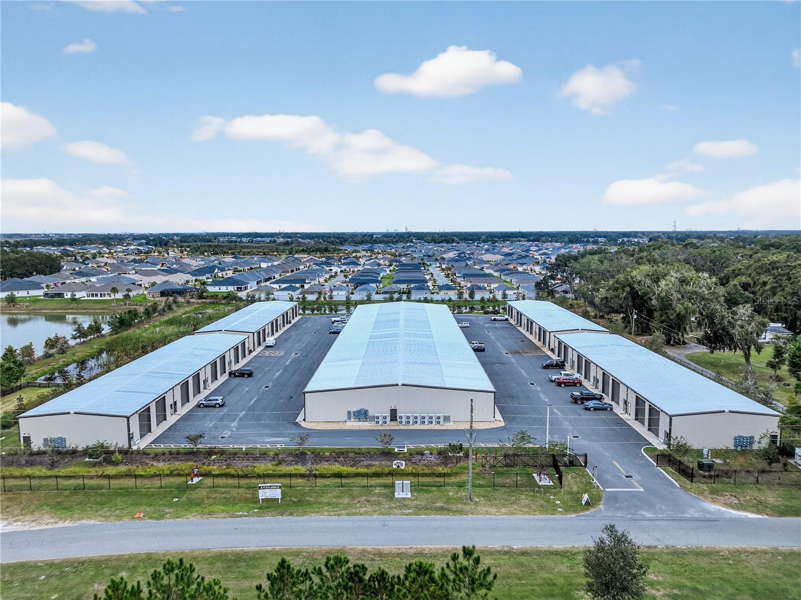 Income!! Income!! Small Bay/Flex Warehouses!! 6% CAP Rate currently with potential for 8% with rent upside.  The property is 100% Leased with outstanding cash flow and located in the heart of The Villages growth path.  This property, known as “The VIP Garage” and was built in 2023 and consists of 5 buildings - 30 units of small bay flex/warehouse - each unit is 2,500 Sq. Ft..  The property is fully fenced with a security gate and video surveillance.  Situated in Wildwood, Florida (The Villages growth area) and sitting almost directly across from Brownwood, The Villages 3rd Town Center and within 1 mile of I-75 and less than a ½ mile from the Florida Turnpike. This is a rare opportunity to purchase an investment property this large with as much cash flow in or around the fastest growing area in the United States.  Each unit has two (2) grade level doors that are 12 ’x 14’ along with a 9 ’x 15’ office, handicap accessible bathroom and every unit has an A/C Unit.  Great location, great property, great income opportunity!