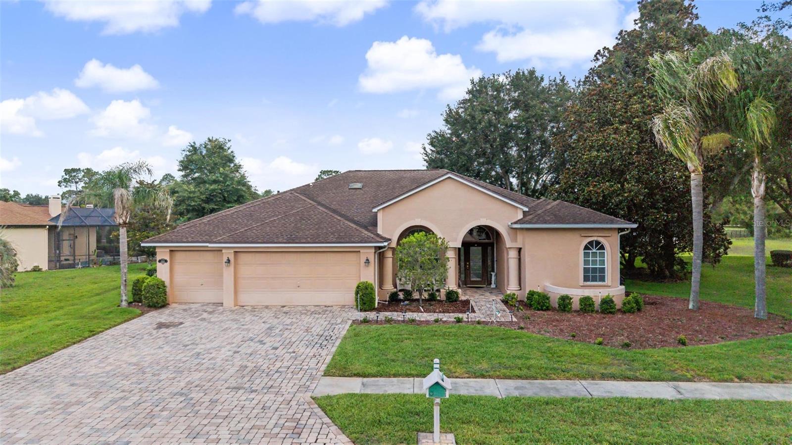 Country Living at Its Finest! Welcome to this beautifully maintained 4-bedroom, 3-bath, 3-car garage pool home nestled within the gated Silverthorn Golf & Country Club community. Perfectly positioned on the scenic 18th hole, this exceptional property offers beautiful golf course views and a peaceful backyard setting, creating the ideal backdrop for relaxing by the pool or entertaining family and friends. Offering the perfect blend of elegance, comfort, and Florida living, this spacious residence is designed for both everyday enjoyment and effortless entertaining.
From the moment you arrive, you'll be impressed by the mature tropical landscaping, paver driveway, and inviting front entry. Inside, the thoughtfully designed open floor plan showcases neutral tones, beautiful wood plank flooring, plantation shutters throughout, detailed baseboards, soaring ceilings, and an abundance of natural light that creates a warm and welcoming atmosphere.
The heart of the home is the beautifully appointed kitchen featuring soaring double tray ceilings, an oversized granite island, built-in electrical outlets, cabinetry on both sides for exceptional storage, stainless steel appliances, a stylish tile backsplash, abundant cabinetry, pendant lighting, recessed lighting, and generous counter space. The kitchen flows seamlessly into the dining and living areas, creating the perfect gathering space for family and friends.
The spacious primary suite serves as a private retreat with direct access to the pool, two separate closets, and a five-piece ensuite featuring an extended dual-sink vanity, soaking tub beneath plantation-shuttered windows, walk-in shower, and a thoughtfully designed toilet area partially separated by a privacy wall. Three additional bedrooms provide flexibility for family, guests, or a home office, while one secondary full bath also offers direct access to the pool for added convenience.
Step outside to your screened-in pool enclosure where you can relax, entertain, or simply enjoy peaceful views of the golf course. The seamless indoor-outdoor flow makes this home ideal for Florida living year-round.
Additional highlights include a functional laundry room complete with washer, dryer, utility sink, and hanging rack, along with a spacious three-car garage providing ample room for vehicles, storage, or hobbies.
Perfectly located in the desirable area, you'll enjoy the charm of country living while remaining just minutes from the crystal-clear waters of Weeki Wachee Springs, Buccaneer Bay, shopping, dining, medical facilities, and the Suncoast Parkway for an easy commute. No matter what you're looking for, this exceptional home checks all the boxes, whether you're seeking space, comfort, luxury, or the perfect place to entertain. Offering the lifestyle you've been searching for, this home is ready to welcome you.