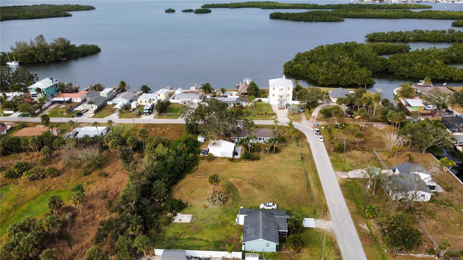 Welcome to a unique opportunity in Ruskin—an exceptional 0.29-acre lot offering deeded boat launch access directly across the street. This rare find is ideal for anyone seeking a true coastal lifestyle, whether you envision building a tranquil waterfront-inspired home, a seasonal getaway, or making a smart investment in a highly desirable location. The property is fully cleared and well-maintained, providing a blank canvas that's ready for your vision. Imagine waking up every day to the serene beauty of the water, with convenient access to boating, fishing, and endless outdoor recreation just moments away. Situated just minutes from Tampa Bay and the iconic Skyway Bridge, this lot is perfectly positioned for easy access to both city life and natural escapes. The area has no HOA or CDD fees, giving you the freedom and flexibility to design and utilize the property as you see fit. Whether you’re seeking a permanent residence, a vacation retreat, or a future investment, this location offers limitless potential. Opportunities like this are becoming increasingly scarce—don’t miss out on the chance to make this slice of paradise your own. Schedule your showing today before it’s gone!