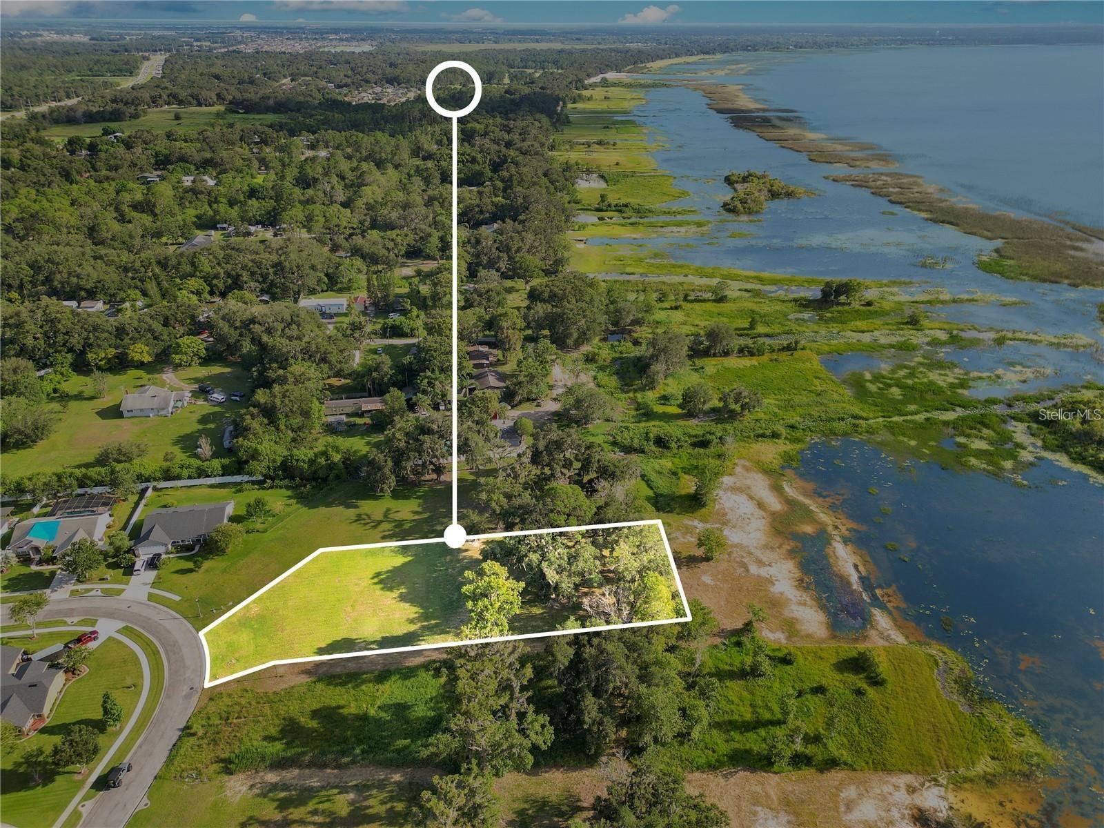 Bring your vision to life on this beautiful vacant waterfront  lot in one of St. Cloud’s sought-after GATED communities. Just shy of an acre, this property offers the perfect opportunity to build your dream home  ! Enjoy peaceful water views, your own private dock, and breathtaking sunsets right from your future backyard. Whether you’re looking to build a full-time residence, second home  or a relaxing retreat, this rare lakefront lot offers the space, scenery, and lifestyle you’ve been searching for Discover the opportunity to build your dream waterfront estate on nearly .8 acres along the shores of East Lake Toho inside one of Osceola County’s most sought-after gated communities.

Unlike newer subdivisions near Lake Nona, this rare homesite offers something increasingly difficult to find — meaningful acreage, direct waterfront access, mature natural surroundings, and lasting privacy.

Positioned to capture breathtaking western-facing sunset views, the property overlooks East Lake Toho with evening reflections stretching across the water, creating the perfect backdrop for future outdoor living and architectural design. A mature oak hammock anchors the rear of the property, offering a natural privacy buffer and an established setting that cleared lots simply cannot replicate.

The recent value repositioning creates an exceptional advantage for the next owner, allowing additional flexibility to immediately incorporate luxury features into the build such as a private dock, resort-style pool, summer kitchen, expansive outdoor entertaining space, or custom lakefront design elements from the very beginning.

Despite the peaceful waterfront setting, the location remains highly connected — just minutes from Lake Nona Medical City, premier dining, shopping, major highways, and Orlando International Airport.

As buildable waterfront inventory near Lake Nona continues to disappear, opportunities like this become increasingly rare. This is more than vacant land — it is the foundation for a lifestyle that cannot easily be replicated.

More land. More water. More privacy. A smarter entry point into luxury waterfront living.

Schedule your private tour today to experience the scale, setting, and sunset views in person.