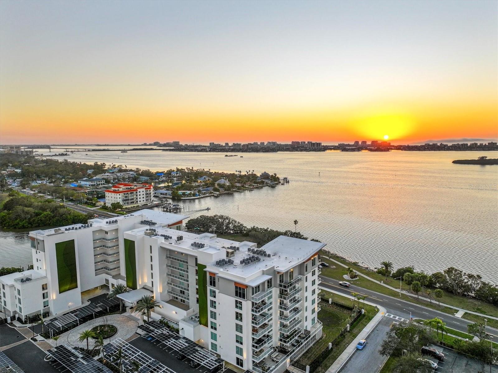 An exceptional opportunity in one of Clearwater’s most sought-after luxury waterfront communities, this beautifully designed 2-bedroom, 2-bath residence at Serena by the Sea is competitively priced below comparable units, offering incredible value for buyers seeking luxury, location, and lifestyle. Experience luxury waterfront living with breathtaking water views in a home designed with a spacious open floor plan filled with natural light, seamlessly blending indoor and outdoor living.

The gorgeous chef-inspired kitchen features a stunning 10-foot waterfall Quartz island, premium Gaggenau gas stove, built-in oven, paneled refrigerator, and custom-designed Italian cabinetry, creating the perfect space for entertaining family and friends. Floor-to-ceiling windows showcase beautiful bay views, creating a peaceful coastal backdrop throughout the main living areas.

The thoughtfully designed split-bedroom layout offers both comfort and privacy, while high-end finishes, hardwood flooring in the bedrooms, abundant closet space, and modern luxury design add to the home’s upscale appeal. Enjoy the private terrace stretching from the primary bedroom to the second bedroom, offering the perfect place to relax and take in the coastal surroundings. The condominium is elevated approximately 10 feet above ground level and also includes an assigned covered corner parking space along with a temperature-controlled storage unit.

Residents enjoy exceptional resort-style amenities including 24/7 concierge service, a heated waterfront saltwater pool overlooking Clearwater Bay, private cabanas, an outdoor grilling area with TVs and seating, elegant fire pit lounges, a luxurious wellness spa with sauna and cold plunge, a state-of-the-art fitness center, stylish clubhouse and social spaces, and secure gated access for peace of mind.

Serena by the Sea is a gated boutique luxury condominium community ideally located just minutes from Clearwater Beach and the shops and restaurants of Dunedin, with convenient access to St. Petersburg, Tampa, and Tampa International Airport. Enjoy being just a short distance from the Pinellas Trail, perfect for biking, walking, and enjoying the Florida lifestyle.
