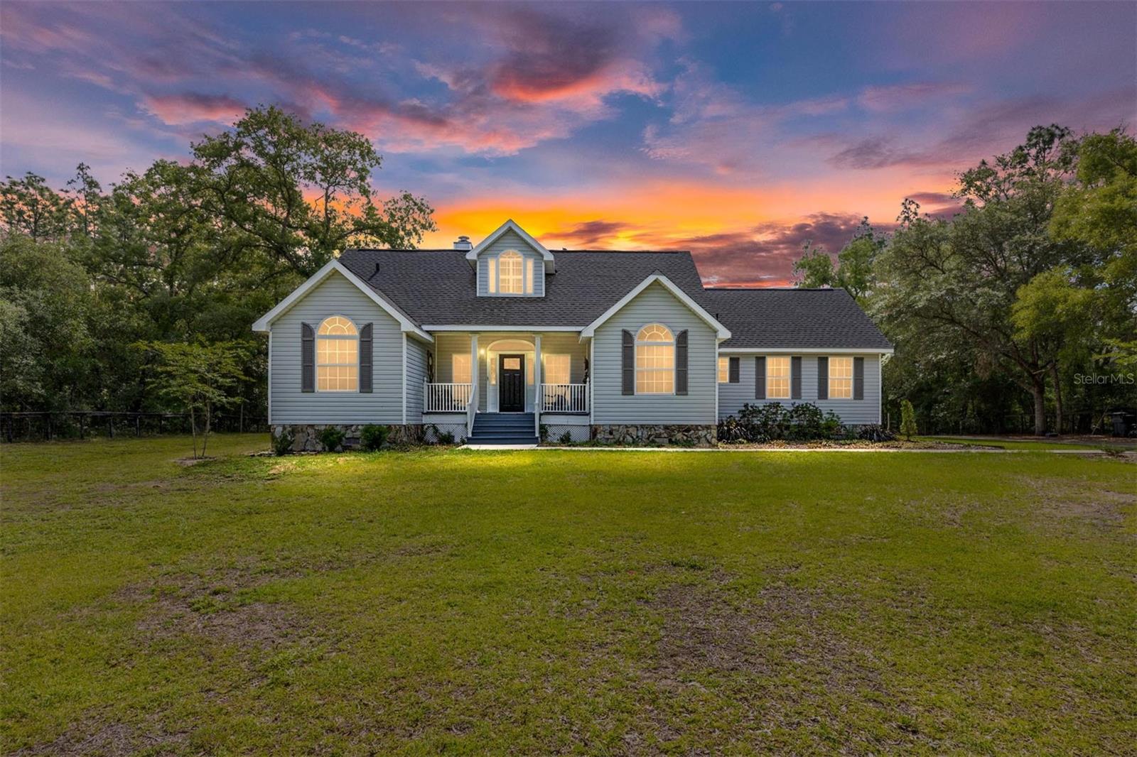 Welcome to Ocala horse country! This beautifully updated home blends modern comforts with the warmth and character of Southern country living on over an acre of fully fenced land. Featuring 3 bedrooms, 2 baths, a brand new architectural shingle roof, new AC in 2023, private gated entry, winding driveway, and upgrades throughout. This move-in-ready property offers the perfect balance of comfort, privacy, and convenience. Enjoy peaceful surroundings with no HOA while remaining within easy driving distance to the World Equestrian Center - Ocala, Rainbow Springs, shopping, dining, and medical facilities. With plenty of room for pets, outdoor hobbies, RVs, or recreational toys, this exceptional property is a rare opportunity to own acreage in one of Marion County’s most desirable and rapidly growing areas. See pictures for more details & upgrades. Schedule your appointment today for your personal tour! This beautiful property won't last long!