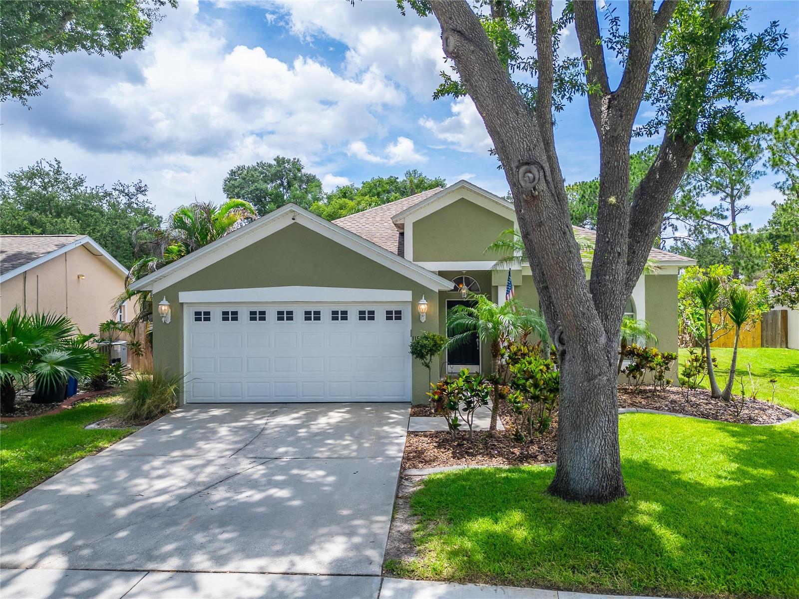 Charming 4BR/2BA pool home nestled under a mature oak canopy on a beautifully landscaped lot! This split-bedroom floor plan offers privacy with a formal living room and  formal dining room, perfect for entertaining. Updated kitchen boasts granite counters, stainless appliances, & tile backsplash. French doors from BOTH the great room and primary owner's suite open to the covered lanai, creating seamless indoor-outdoor flow. Convenient interior laundry room adds everyday functionality. Step outside to your fully fenced private oasis — sparkling pool, paver patio, mature palms & a bonus outdoor shed, ideal for a home office, studio, or extra storage. Updated plumbing offers added peace of mind. Don't miss this move-in-ready gem!