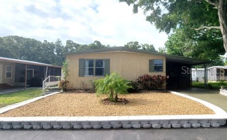 Welcome to this well-maintained 1982 manufactured home offering approximately 960 square feet of living space (24 x 40) in the heart of Pinellas County, Florida. This charming 2-bedroom, 2-bathroom double-wide features a spacious great room, an attached screened porch, covered carport suitable for a golf cart, and a convenient storage shed, providing comfortable Florida living both indoors and out.

Numerous updates have been completed within the past two years, including new laminate flooring throughout, remodeled showers in both bathrooms, a new central HVAC system, new vapor barrier, new AC ductwork, and a new electrical panel, offering added peace of mind for the next owner.

Located within Paradise Park Co-Op, a sought-after 55+ community (with the possibility of a resident age 45+ upon community approval), this home offers a welcoming and active lifestyle. Residents enjoy a unique cooperative ownership structure, providing membership in the corporation that owns the land and fostering a strong sense of community involvement.

The monthly lot fee of $1,035 includes water, sewer, trash, and lawn maintenance, helping simplify everyday living. Community amenities include a heated pool, shuffleboard courts, clubhouse, library, billiards room, and a variety of planned social activities throughout the year.

Conveniently located near shopping, dining, beaches, medical facilities, and all that Pinellas County has to offer, this property presents an excellent opportunity to enjoy affordable Florida living in a vibrant and well-maintained community.

Furniture is currently in place for staging purposes and may be negotiated separately with the sale.