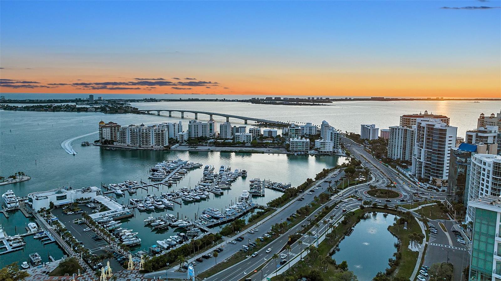 Experience elevated downtown living in this exceptional residence at The DeMarcay. Unit 701 offers three spacious bedrooms and an elegant blend of modern finishes with timeless sophistication, creating the ideal balance of luxury and comfort. Expansive windows fill the home with natural light while framing breathtaking waterfront views of Sarasota Bay, the marina, downtown skyline and the iconic Ringling Bridge. Designed for entertaining and everyday living, the open-concept floor plan flows seamlessly onto a private balcony where you can enjoy vibrant sunsets and the energy of downtown Sarasota below. The chef-inspired kitchen features sleek contemporary design, premium finishes, a walk-in pantry and refined details throughout. Enhancing the residence is a state-of-the-art Lutron motorized shade system by Haven Smart, offering effortless convenience and modern luxury at touch of a button. The owner's suite is a private retreat featuring a beautifully upgraded custom closet and spa-inspired ambiance. Additional highlights include two assigned parking spaces in the secured garage, EV charger capability and an air-conditioned storage locker. With no pet restrictions, this residence offers flexibility for every lifestyle. Residents of The DeMarcay enjoy an unmatched collection of luxury amenities, highlighted by a stunning rooftop pool and entertaining deck overlooking the marina, Sarasota Bay, downtown skyline and the sparkling Ringling Bridge. The building also offers 24/7 valet service and on-site staff, delivering a lock-and-leave luxury lifestyle. Ideally in the heart of downtown Sarasota, this exceptional residence places you moments from world-class dining, boutique shopping, theaters, art galleries and the city’s vibrant cultural scene. Luxury waterfront living meets modern downtown convenience in one of Sarasota’s sought-after addresses.