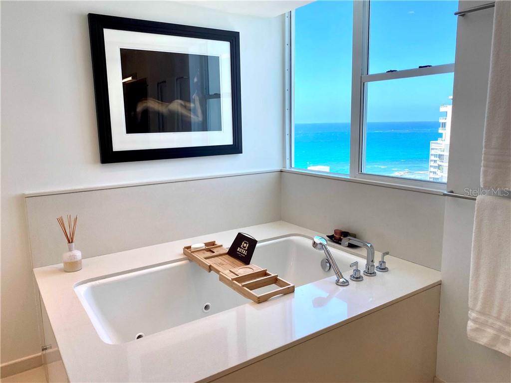 Luxurious 3-story penthouse apartment in Acquamarina condo. Enjoy great city and ocean views from it's spacious terrace. The apartment consists of 5  bedrooms, 4 baths, 2 powder rooms, 1 maids quarter, elevator, 3 covered parkings & storage area. Large kitchen with Italian cabinets, pantry, breakfast area, and top of the line appliances. All rooms pre-wired for audio/visual. Surround sound speaker system throughout the apartment. Beautiful quartz floors and recessed lighting throughout. Condo amenities include 24-hr security, pool, gym, full power generator, water cistern and direct access to beach.  Excellent location in the heart of Condado. Next to the Marriott Hotel. HOA: $1,520 monthly.