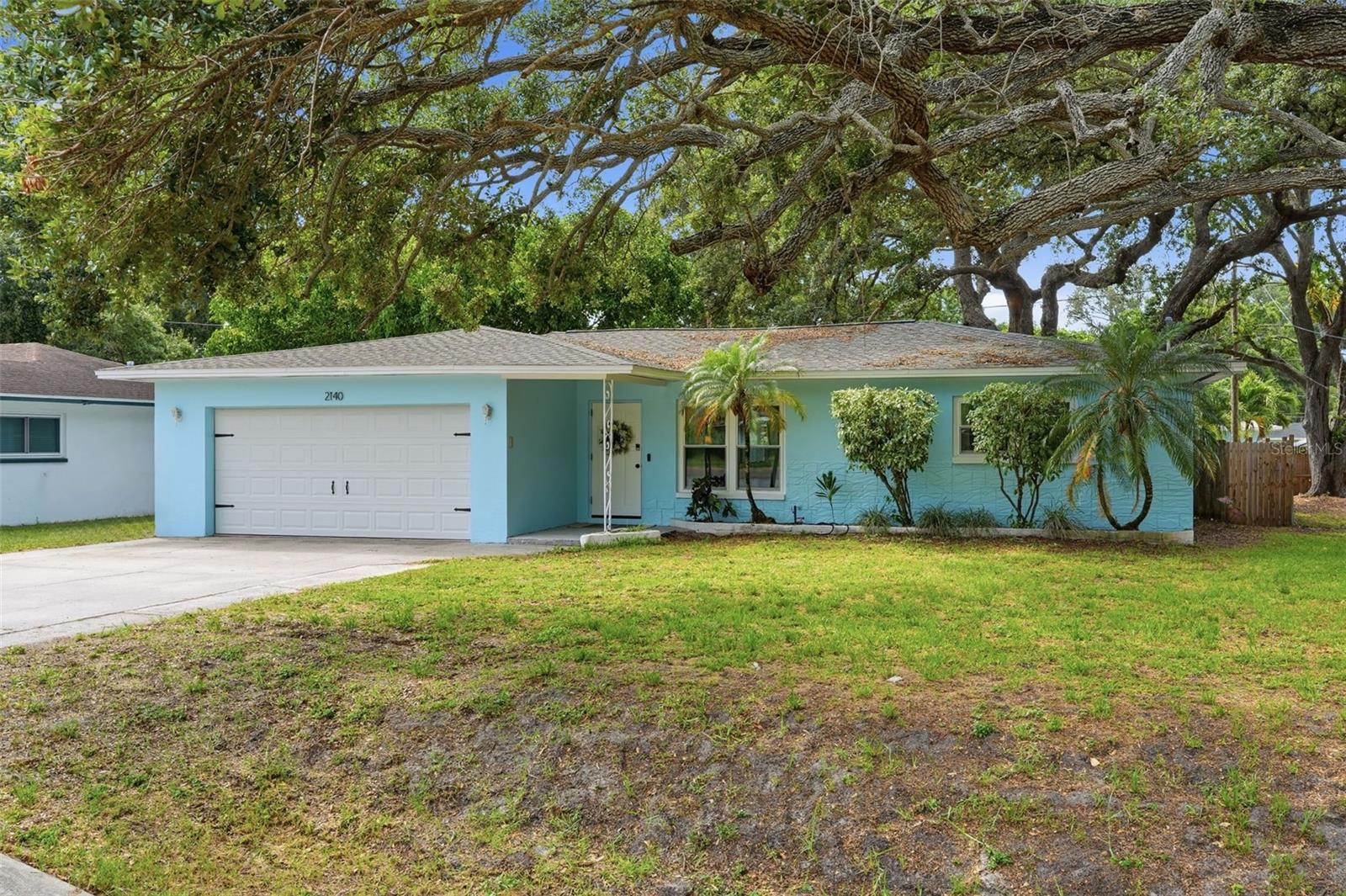Move-in ready and beautifully updated, this charming home offers the perfect combination of comfort, convenience, and value. Recent improvements include BRAND NEW WINDOWS installed June 2026, a freshly painted exterior, a completely remodeled bathroom, and newer luxury vinyl flooring. The home features carefree tile and vinyl flooring throughout, ceiling fans, abundant natural light, and a functional layout designed for everyday living and entertaining.

The spacious kitchen offers plenty of cabinet and storage space, a breakfast bar, and an eat-in area large enough for a kitchen table, making it the perfect gathering place for family and friends. In addition to the casual dining space, there is also a separate dining room for more formal meals and special occasions.

Step outside and enjoy the fully fenced backyard, providing privacy and plenty of room for pets, play, gardening, or outdoor activities. The backyard deck creates an ideal setting for entertaining, barbecues, or simply relaxing and enjoying Florida's beautiful weather.

Additional features include an oversized two-car garage complete with a convenient half bath, offering extra functionality for hobbies, projects, or outdoor gatherings. Best of all, flood insurance is not required and there is no HOA, giving you greater flexibility and lower ownership costs.

Ideally located near major thoroughfares for an easy commute and just minutes from beautiful Gulf beaches, shopping, restaurants, parks, and everyday conveniences, this home delivers the Florida lifestyle you've been looking for.  Schedule your showing today before it is too late.
