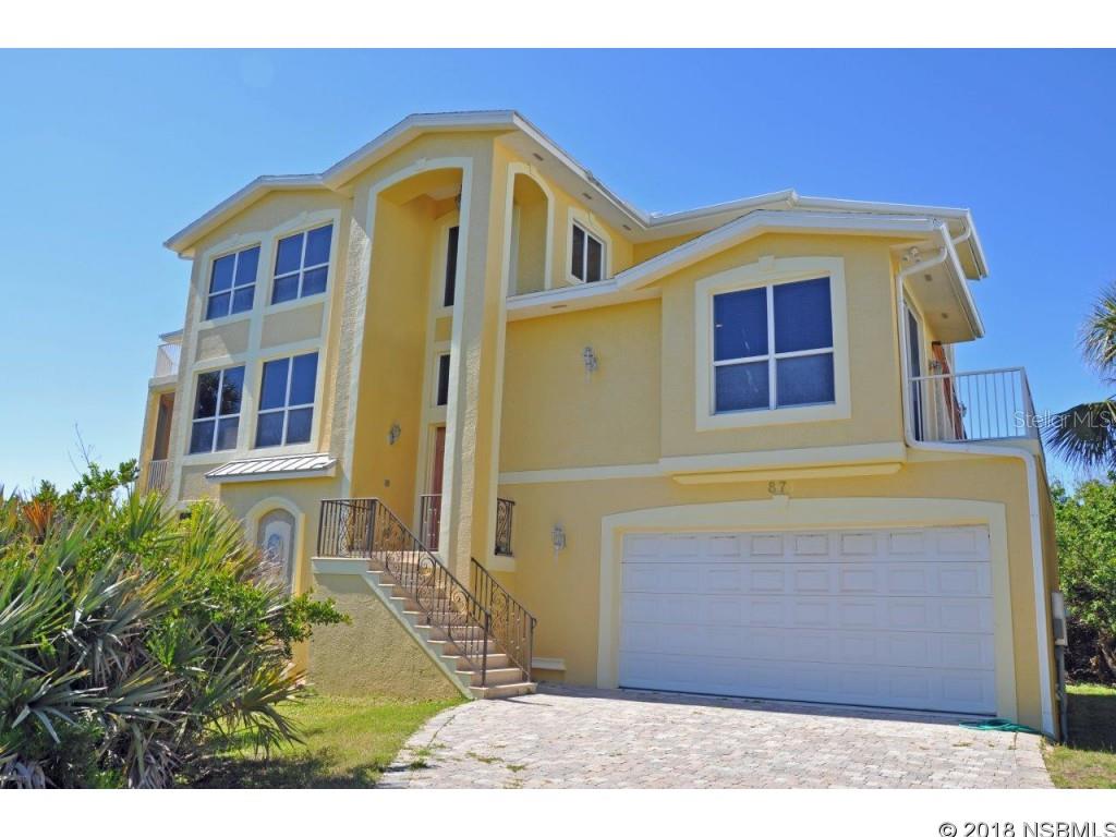 Natural serenity on Indian River Lagoon, this 2007-built, 5 bdrm, 5.5 bath beachside home is convenient to beach walkover.  Outstanding views!  Concrete construction on all levels.  Impact windows.  Extensive use of granite & marble. Brazilian cherry floors throughout.  Eat-in kitchen with stainless appliances & double ovens.  Diningroom with wet bar.  Huge family room with wet-bar & refrigerator.  Master bath features spa tub, marble vanity & flooring.  All bedrooms can be used as suites.  Separate sauna.  Most rooms open to either screened or open porches or patios.  Special air filtering for all 3 HVAC systems.  Water filtration system.  This home has hardly been lived-in, is well-maintained and offers the opportunity to comfortably fit a large family, extended family, home-office, full-time residence or vacation compound very close to the beach!  Diningroom chandelier is excluded.  Motivated seller!  Bring offers! ;Water: City