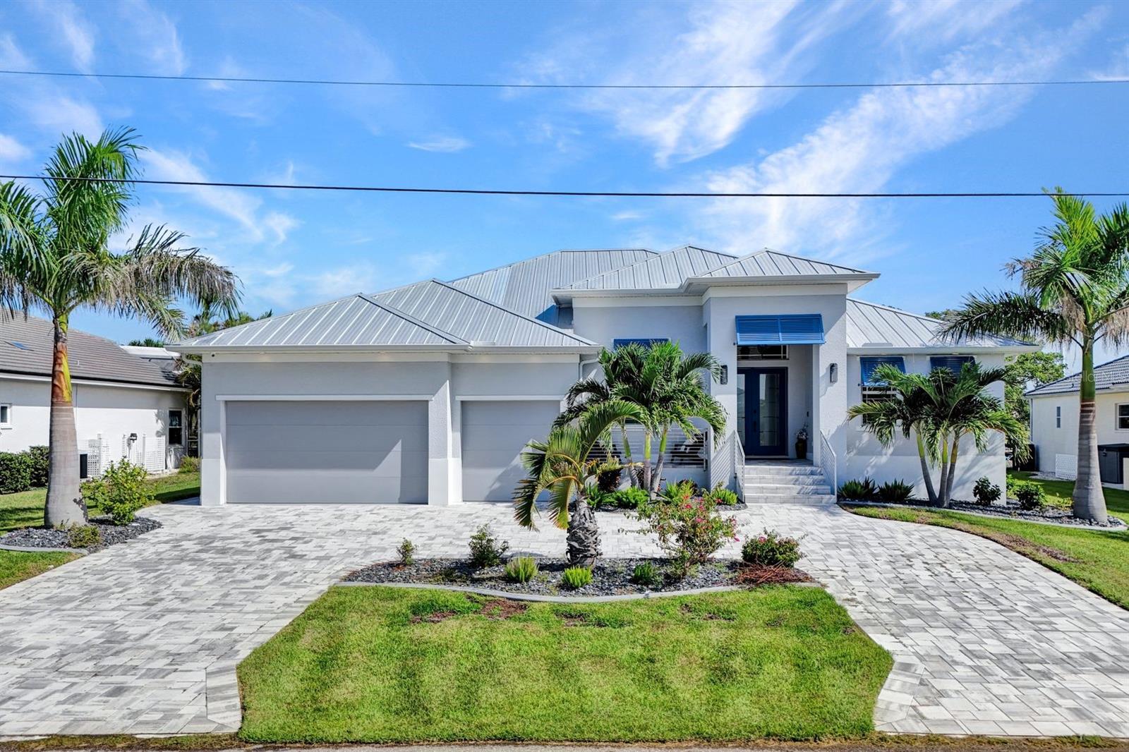 Nestled in the picturesque city of Punta Gorda, this waterfront haven offers direct Gulf Access and a lifestyle of unparalleled luxury. Imagine stepping into a world where the views and outdoor spaces effortlessly blend into one stunning panorama, a saltwater pool and spa adorned with handcrafted marble pavers invites you to unwind, while an expansive kitchen sets the stage for a fresco dining under the stars. Enjoy effortless peace of mind with Hurricane Shutters impact resistance windows, a remote controlled hurricane protection screens and no-see-um screens, all while savoring the canal view. A 13,500 lb. boat lift beckons boating enthusiasts, with a boat available for purchase separately for those eager to explore the sparkling waters. Inside, discover elegance of Thermador Appliances in a kitchen that boasts a grand island, perfect for family gatherings and entertaining. Marvel at the soaring ceilings and the modern allure of features 10' zero corner pocket sliders, seamlessly blending the indoors with the outdoors. Conveniently located just minutes from downtown Punta Gorda and Fishermans Village, with easy access to an array of amenities, and only 10 minutes by boat to the beautiful Charlotte Harbor. With over $300,000 in high end enhancements and furnishing negotiable, this home is move in ready. This property is a sanctuary of style and convenience, offering aa slice of paradise tailored to your dreams.