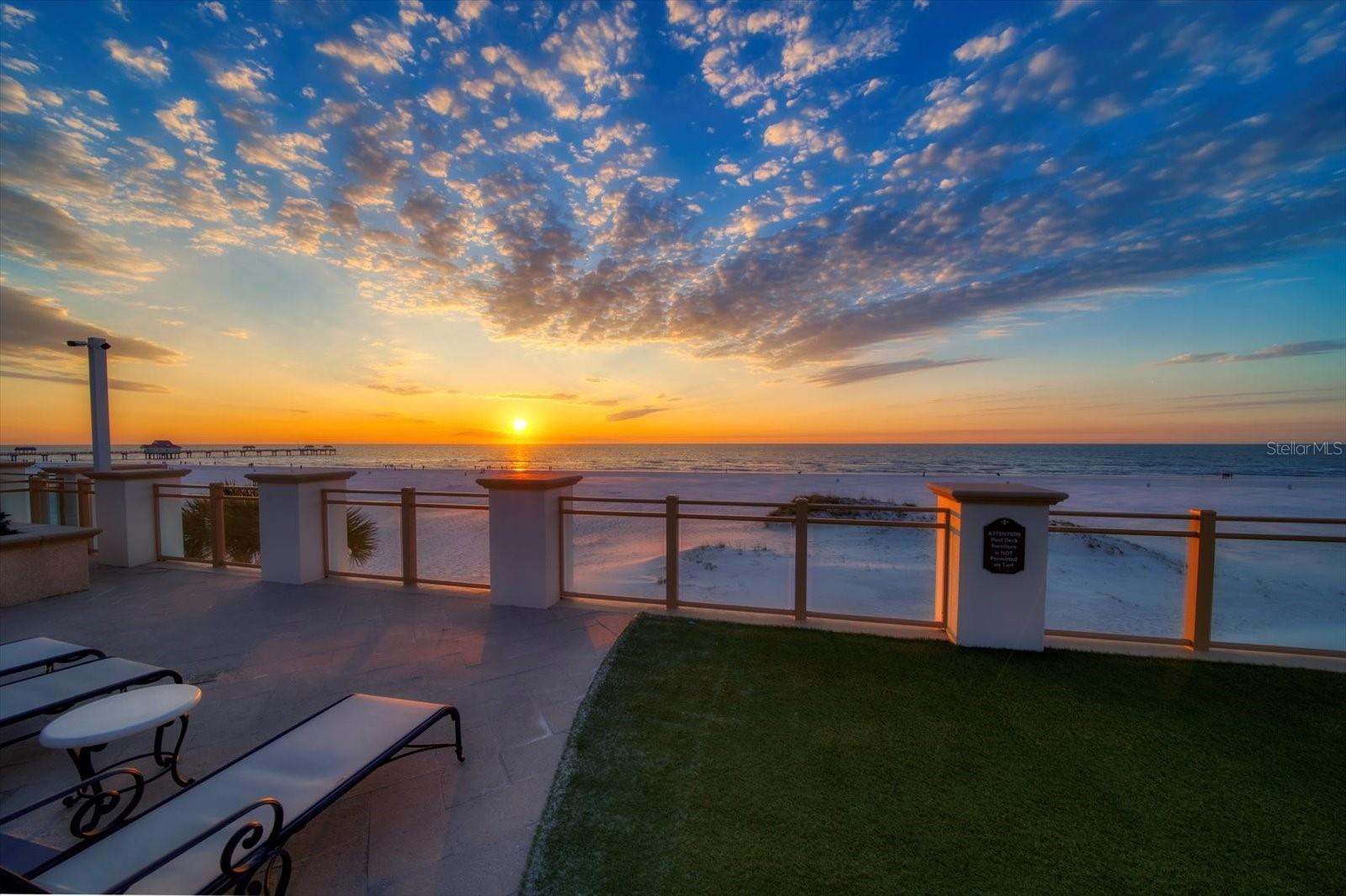 Experience the essence of coastal luxury in this exquisite Gulf-front condo located
in the Residences at Sandpearl on beautiful Clearwater Beach. Designed with
tranquil tones and high-end finishes, this third-floor retreat lives like a single-
family home while offering the convenience of resort-style living.  This unit offers the unique opportunity to be combined with Unit 306, also currently on the market, to create an expansive residence exceeding 3,700 sq. ft. The open floor
plan welcomes you with a spacious kitchen featuring granite countertops, stainless
steel appliances, and a breakfast bar, seamlessly flowing into the family and dining
room combo. Natural light floods the space through walls of sliders, leading to an
expansive wrap-around terrace spanning nearly 2,000 square feet. Secluded by lush
landscaping, this private oasis offers breathtaking Gulf views and mesmerizing
sunsets. Perfect for hosting, the terrace provides direct access through a private
gate to the resort-style pool, grill area, and cabanas, as well as Clearwater Beach.
Celebrate local events like the Stone Crab Festival or enjoy fireworks on July 4th
and New Year’s from the comfort of your terrace. The desirable split-bedroom
layout ensures privacy and comfort. The spacious primary suite features a walk-in
closet with custom built-ins and a spa-like ensuite with a double sink vanity,
garden tub, and walk-in shower. Two additional bedrooms—one with an ensuite
bath—offer generous closet space and private terrace access. An indoor laundry
room with a utility sink adds to the convenience. Residents enjoy unparalleled
amenities, including a fitness center with a steam room and sauna. Just steps from
marinas, acclaimed restaurants, and vibrant local hotspots, this residence combines
beachfront tranquility with the best of Clearwater Beach living. Don’t miss the
chance to call this Gulf-front haven your home!