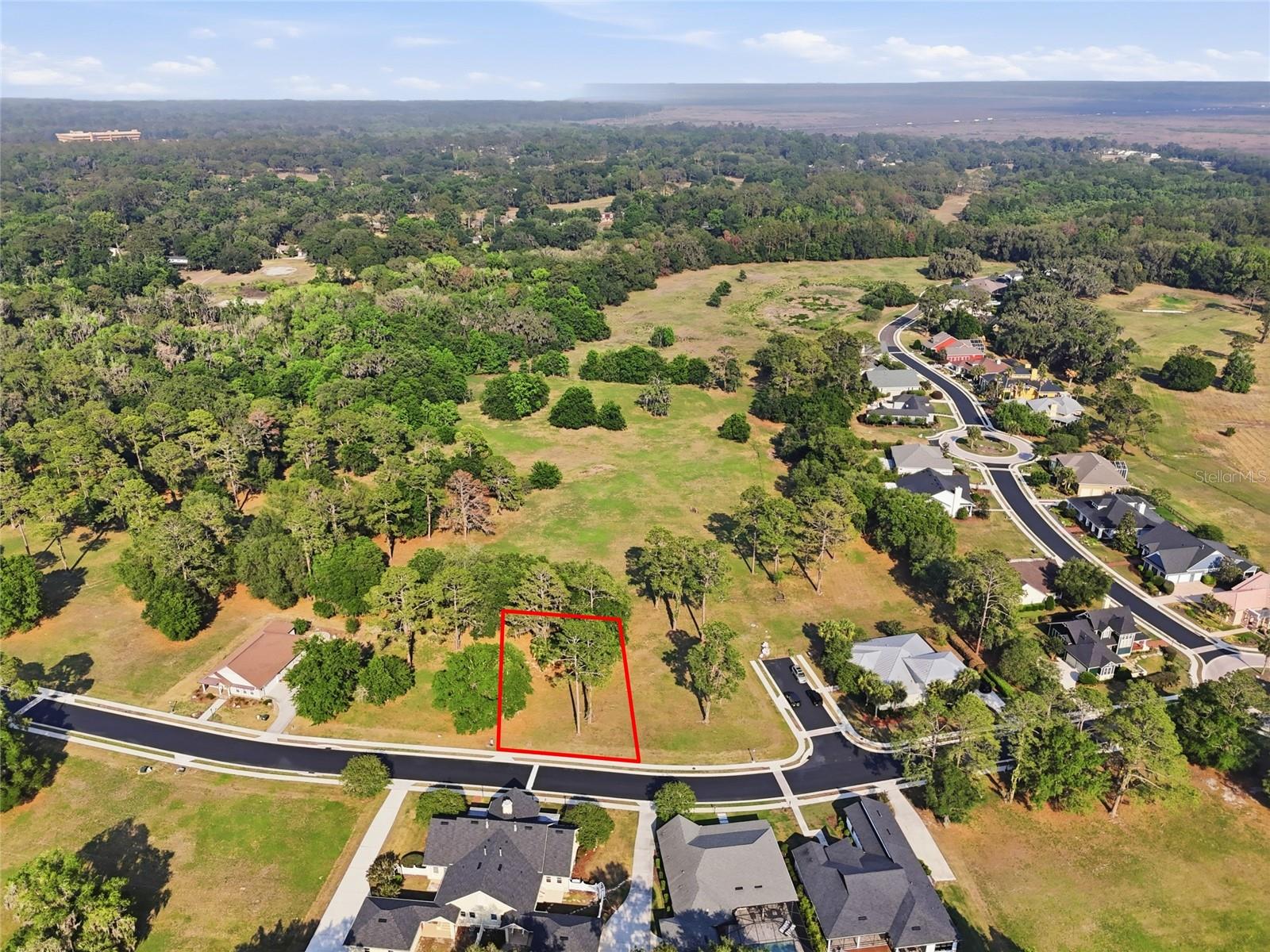 Build the custom home you've always envisioned on this stunning lot nestled within the exclusive, gated community of Savanna Pointe. Mature trees dot the landscape, offering natural beauty and privacy. Sip your morning coffee on the front porch and soak in the serenity, or stroll along the sidewalk through this sought-after enclave of luxury residences. Perched on the edge of Paynes Prairie, Savanna Pointe offers something truly unique — a private golf cart path with direct access to the Gainesville Country Club. The location couldn't be more convenient, with UF Health, the University of Florida, and the VA Medical Center all within approximately 5 miles. When it's time to shop or dine, Celebration Pointe and Butler Plaza are just 3 miles away, and quick access to the I-75 corridor makes getting around a breeze. This is an open builder lot with a minimum build requirement of 1,500 sq ft — your blank canvas awaits. Contact us today to schedule your private tour.