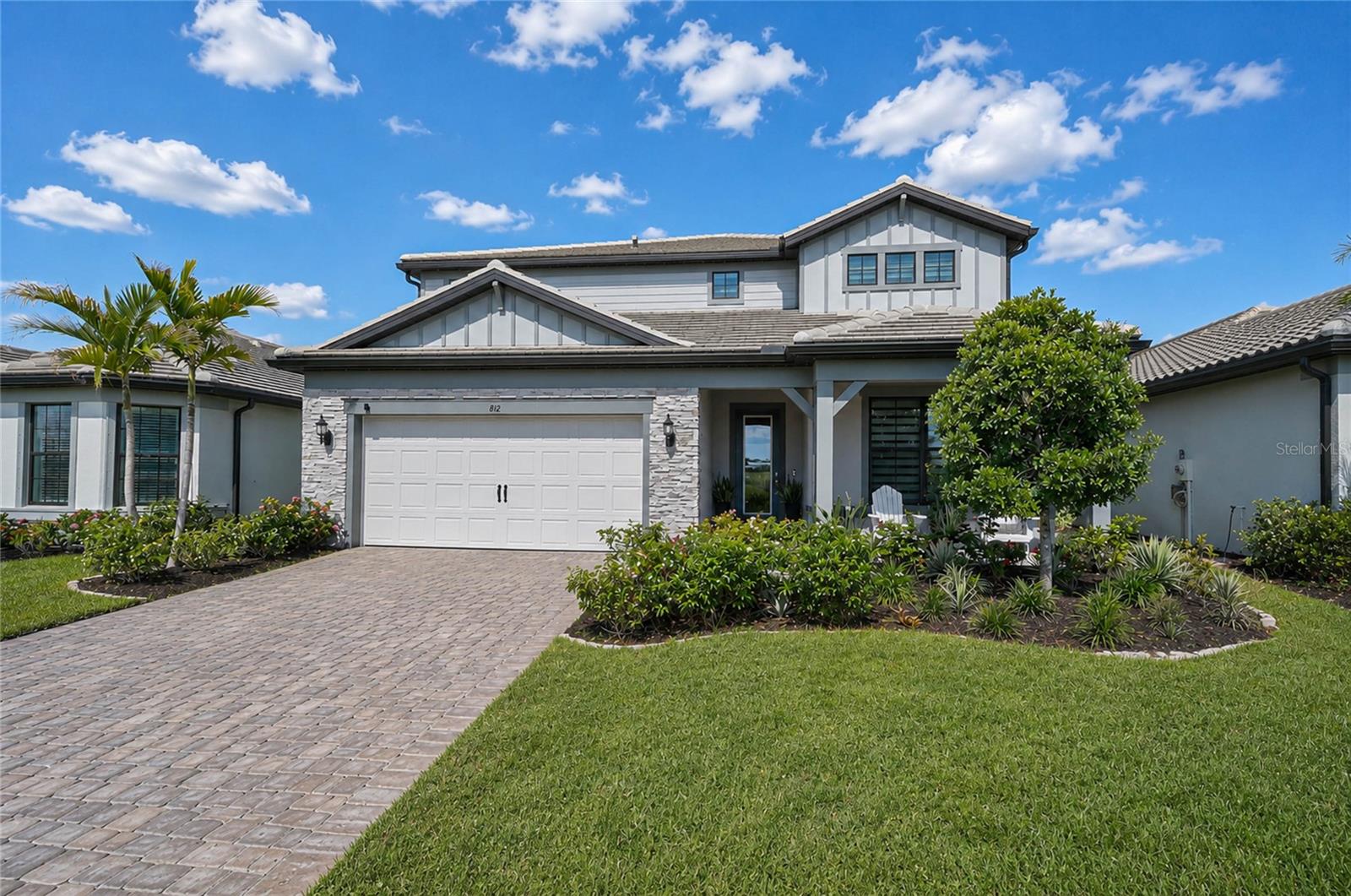 Where Private Pool Living, Gated Charm & the FL Lifestyle All Come Together!
Welcome home to Magnolia Ranch, a smaller 72-home boutique gated neighborhood in one of East Bradenton’s most convenient and desirable locations. Built in 2023, this beautifully upgraded 5 bedroom, 4.5 bath pool home offers over 3,400 square feet of living space, a 3-car tandem garage and the kind of indoor-outdoor lifestyle Florida buyers dream about. From the moment you arrive, the home makes a strong first impression with its paver driveway, tile roof, stone accents, upgraded landscaping and permanent Govee lighting with customizable colors and holiday settings. Inside, a bright and open floor plan blends everyday comfort with elevated style, featuring upgraded lighting, custom blinds, neutral finishes and thoughtful design details throughout. The heart of the home is the open kitchen, dining and living area, where a large center island, modern pendant lighting, abundant cabinetry and generous prep space come together to create a stylish and highly functional hub for everyday living and entertaining. The spacious layout flows effortlessly into the dining and living areas, making it easy to host gatherings while staying connected with family and guests. The living room is anchored by a custom-style entertainment wall, while pocket sliders open the space to the covered paver lanai and private screened pool, creating a seamless connection between the indoors and outdoors. The backyard is one of the home’s standout features, offering a private pool, paver patio, covered dining area, color-changing string lights and a retractable shade that can be lowered over the lanai and sliding doors for added comfort. Whether you are hosting friends, watching the game outside or enjoying a quiet evening by the pool, this space feels like a private retreat. The layout is just as functional as it is beautiful, with five bedrooms, four and a half baths, large closets, additional storage and a spacious upstairs loft that can serve as a media room, playroom, game room, homework area or second living space. The primary suite offers a generous retreat with an accent wall, large bath, dual vanity and excellent closet space. The secondary bedrooms are well-sized, giving everyone room to spread out. And multiple flex rooms make wonderful space for your additional needs. Additional upgrades include hurricane windows, an epoxy flake garage floor and a 3-car tandem garage with extra room for storage, bikes, tools, holiday décor and more. Magnolia Ranch also offers No CDD’s, low-maintenance living, with the HOA covering the community gates, irrigation and grounds maintenance. The location adds even more appeal. Set in the growing Upper Manatee River area of East Bradenton, Magnolia Ranch offers a peaceful residential setting with convenient access to everyday essentials, area schools, shopping, dining, parks and recreation. From here, you are close to the Fort Hamer Bridge, Lakewood Ranch, Parrish, I-75, Costco, dining, medical offices and the expanding amenities of the surrounding area. It is a location that gives you the quiet feel of a smaller gated neighborhood while keeping you connected to some of Manatee County’s most desirable destinations. With a private pool, upgraded finishes, a flexible family-friendly layout and the ease of a smaller gated neighborhood, this Magnolia Ranch home delivers the perfect blend of style, comfort and convenience in the heart of East Bradenton.
