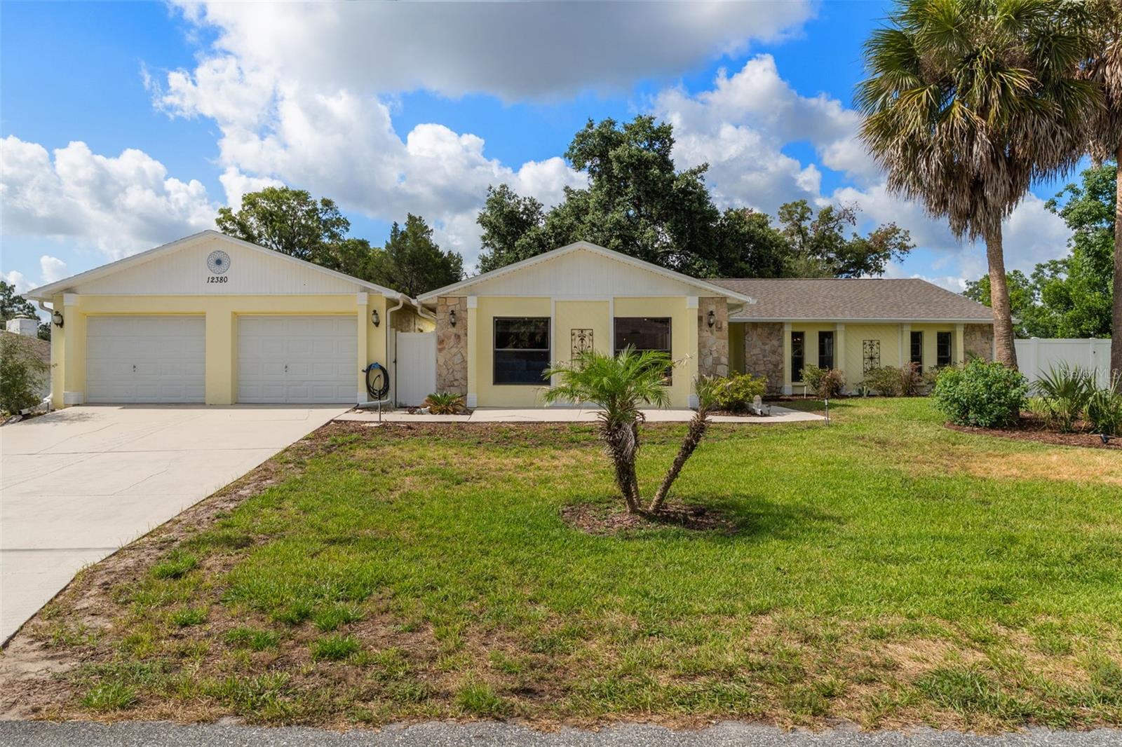Come check out your meticulously maintained POOL home along with a 2026 ROOF, offering the perfect combination of space, functionality, and privacy! Situated on a fully fenced half-acre lot in the heart of super desirable 34609 Spring Hill zip code, this BLOCK construction home boasts an impressive 2,340 square feet of living space and features exuberant amount of space and possibilities. Step inside and be greeted by soaring cathedral ceilings, a cozy fireplace, and a spacious open-concept layout designed for both everyday living and entertaining. To the right you will find the kitchen of your dreams!! Featuring convenient breakfast bar overlooking the living room, along with views of your sparkling pool and gorgeous backyard, keeping everyone connected while hosting family and friends. This versatile 4-bedroom, 2-bathroom home offers plenty of room for the entire family. The oversized fourth bedroom features its own private exterior entrance, making it an ideal mother-in-law suite, guest quarters, home business space, or private retreat. Outside, you'll find your own backyard oasis complete with a large swimming pool, screened and covered lanai, beautiful mature landscaping, and a charming pond that adds to the property's peaceful setting, along with great sized outdoor shed. Need extra storage or workspace? The detached two-car garage includes an additional rear room perfect for a home office, workshop, hobby room, gym, or additional living space, the possibilities are endless. Additional highlights include a dedicated RV parking pad located behind the fence, irrigation system that runs on a dedicated well, gutters, ample parking, and a property that has been exceptionally well cared for throughout ownership. If you've been searching for a spacious home with room for your toys, guests, hobbies, and outdoor enjoyment, this one checks all the boxes. Conveniently located near shopping, dining, schools, and major roadways, this rare Spring Hill property offers the space and flexibility that are becoming harder and harder to find. Schedule your private showing today!