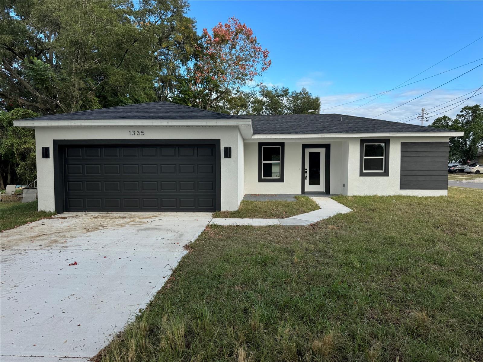 New construction contemporary 3-bed, 2-bath home with 1,250 sq ft living space. Featuring stainless steel appliances, white cabinets, and the convenience of city water and sewer. Enjoy the added allure of a corner location. The spacious open floor plan allows ample space for entertaining with an open-concept Kitchen/Great room. Buy with confidence, as this solid new construction home also comes with the Builder's 2-10 Warranty, providing a comprehensive 2-Year Warranty on the home's mechanical systems along with a 10-Year Structural Warranty on the foundation