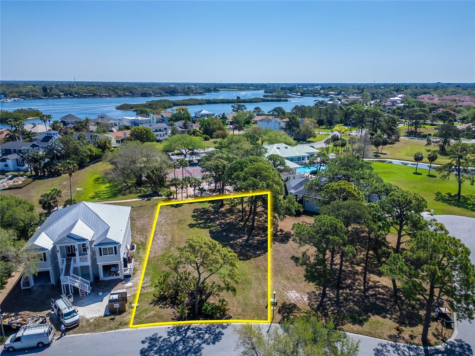 Design and build the home you’ve always envisioned on this exceptional homesite located within the exclusive, guard-gated waterfront community of Harbour Watch. Opportunities like this are becoming increasingly rare, as this is one of the few remaining lots of this size, in a thoughtfully designed neighborhood of just 184 residences, set on a stunning 90-acre peninsula surrounded by the Gulf of Mexico to the west and the Anclote River along the east and north.

This oversized .36-acre lot offers added privacy with no rear neighbors and ample space to create a custom residence tailored to your lifestyle. Build upward and take advantage of the potential for breathtaking water views from elevated living spaces.

Harbour Watch is known for its scenic coastal setting and resort-style amenities. Residents enjoy access to a beautifully appointed clubhouse featuring a fitness center, full kitchen, gathering spaces, and billiards, along with a junior Olympic lap pool, heated spa, and expansive sun deck. Spend your evenings at the community dock or gazebo taking in unforgettable sunset views, or enjoy fishing from the pier. The neighborhood also features lighted tennis courts, a playground, and picnic areas designed for relaxation and connection.

Conveniently located just minutes from local beaches, the famous Sponge Docks, and a wide variety of dining, shopping, and entertainment options, this community offers the perfect blend of tranquility and accessibility. Outdoor enthusiasts will also appreciate the nearby Pinellas Trail for walking, biking, and running.

With 24/7 gated security, highly rated schools, and the flexibility to choose your own builder, this property is truly ready for your vision to come to life. Secure your place in one of North Pinellas County’s most desirable waterfront communities before it’s gone.