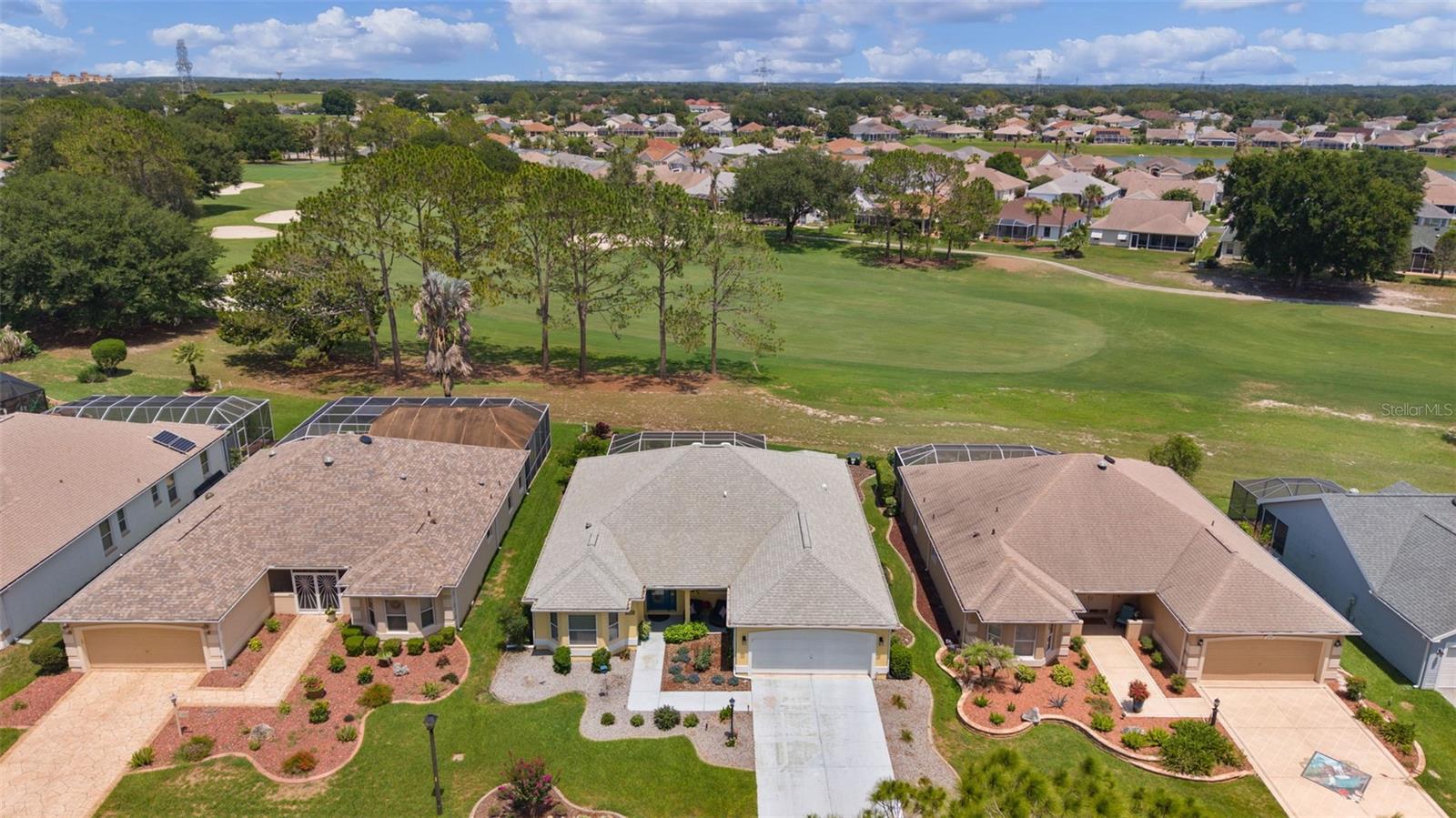GOLF FRONT HOME with PANORAMIC VIEWS~!  NO BOND~! Located on the 4th Hole of Tierra Del Sol Championship Golf Course across the fairway from the Golf Cart Path...STUNNING~!  On a Quiet cul-de-sac, low traffic just 100 yards from a Peaceful Park Area.  Completely Renovated: NEW Cabinetry, Quartz Counter Tops, Flooring, Knokdowwn Ceilings, Appliances, Lighting, Screened Enclosure, etc.~!  Majestic SUNRISES~!  Room for a POOL.
All New Bath and Shower areas.  Upper-End Funiture Included.  Relax on the Covered Front Porch and Enjoy Breath-taking SUNSETS, Abundant Wildlife, and Serene Views across the street. A Leaded Glass Front Door Welcomes you into the Grand Entryway, opening to a Spacious Great Room, Formal Dining area, and Beautifully Updated Kitchen.  The Kitchen has Stainless Appliances, Quartz Counters and a Center Island that is a Focal Point of the Home.  The Breakfast Nook has a Bay Window Wall looking out across the fairway...Phenonenal~!  The Expansive 31' x 26' Screened Enclosure provides an ideal space for Entertaining or simply enjoying the Picturesque Golf Course Setting. Access is available from both the Breakfast Nook and Great Room...Very NICE~!  The Primary Bedroom has Two Walk-In Closets, and a Luxurious En-suite Bath with Dual Vanities and Newly Re-Designed Walk-In Shower~!
Bedroom 2 has a Bay Window Wall area with Unobstructed Western Views, while the Guest Bathroom has been Completely Remodeled, including the Tub/Shower Combination.  The Interior Laundry Room has a New Washer and Dryer, Custom Cabinetry, a Built-in Sink and a Custom Tile Floor.  ROOF 2021, HVAC 2014.  The Extra-Deep Garage with an additional Refidgerator/Freezer.  5 minutes from Shopping, Restaurants, and Hospital.  7 minutes to Spanish Springs Town Square and 9 minutes from Lake Sumter Landing Square.  4 Championship Golf Courses and many Exectutive Golf Courses is a very close golf cart drive away.  Pickleball, Tennis, Boce Ball, Swimming, etc. within minutes from this Wonderful Home...Truly a MUST SEE~!!!