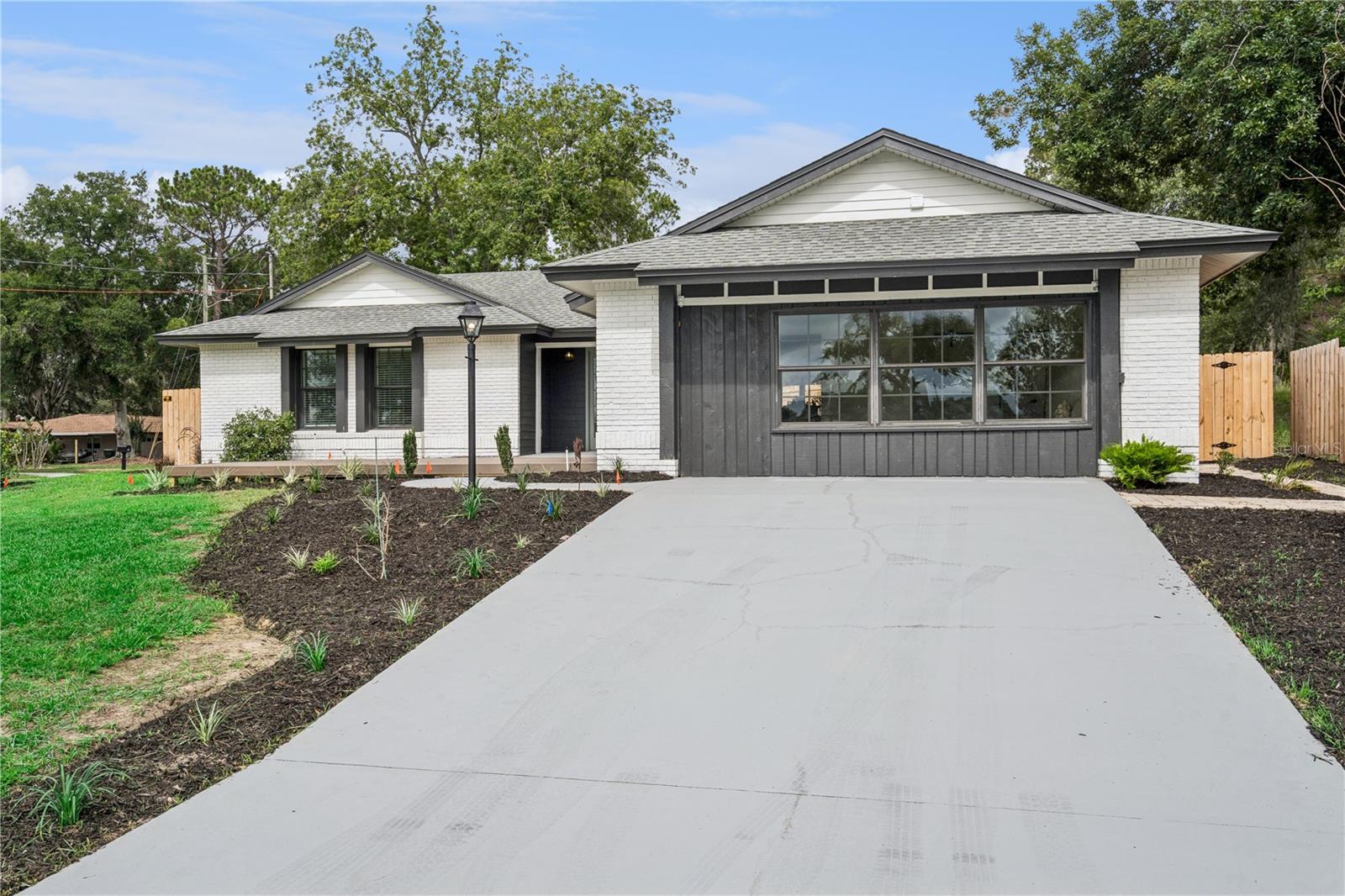 Lakefront living on the sought-after Clermont Chain of Lakes! Situated on a rare double lot totaling nearly 0.8 acres, this beautifully remodeled home offers direct frontage on Lake Winona, complete with a brand-new dock and boathouse, NO HOA.The property provides plenty of space for your boat, RV, jet skis, motorcycles, and other recreational vehicles. Enjoy stunning lake views from the front deck, the perfect spot for morning coffee, evening sunsets, or entertaining family and friends.
Inside, the home has been thoughtfully remodeled from top to bottom with high-end finishes and attention to detail throughout. Luxury vinyl plank flooring through the living spaces, while the stunning kitchen features new custom cabinetry, beautiful quartz countertops, new stainless steel appliances, and updated lighting and plumbing fixtures creating a clean and modern feel.
The spacious primary suite is a true retreat, offering enough room for a cozy reading area, sitting space, or even a home office overlooking the lake. Wake up each morning to peaceful water views and unwind at the end of the day in the beautifully designed primary bathroom, complete with a large walk-in shower, elegant finishes, and a double-sink vanity.
Additional improvements include a brand-new HVAC system, roof replaced in 2018, new irrigation system, fenced backyard, parking pad, and a covered enclosed patio.
Located just minutes from Downtown Clermont, you'll enjoy easy access to local restaurants, shopping, waterfront parks, trails, and everything that makes Lake County one of Central Florida's most sought-after places to live.

Opportunities like this don't come around often. If you've been searching for a move-in-ready lakefront home with land, upgrades, and direct access to the Clermont Chain of Lakes, this is one you won't want to miss.