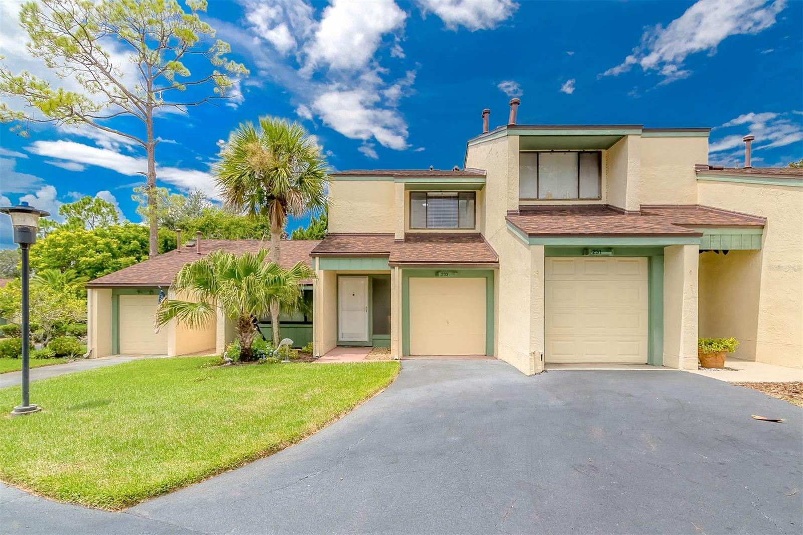 Located in the gated Sugar Mill Country Club is a highly sought-after townhome. The unit is in move-in ready condition and comes with its own garage for a golf cart and 1 assigned covered spot. 1st floor features living room/dining room combo, kitchen, & 1/2 bath with the laundry area. There's also a cozy patio off the living room for added outdoor relaxation. 2nd floor, 2 nice sized bedrooms each equipped with its own bath and generous walk-in closets. A private balcony off of the primary bedroom offers a serene space to unwind. Golf lovers will appreciate the close proximity to the golf course; while membership is available, it's not required. This property also sits High and Dry! confidently above any flood concerns, no need for flood insurance here. Great Location!  Only minutes away from the beach and having close proximity to I95 and Downtown New Smyrna. Last but not least, the HOA fees in this community cover a myriad of services and amenities. This includes building insurance, Lawn care, pest control, a community pool, and gated security. This condo presents a harmonious blend of convenience, luxury, and recreation. Call to see! ;Water: City