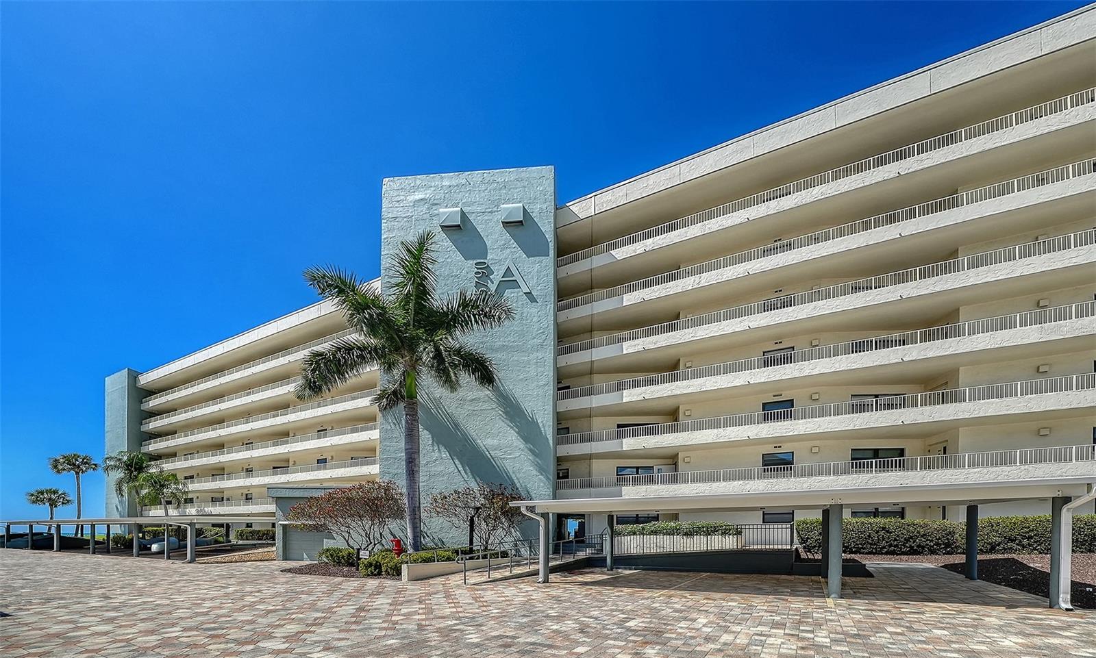 Gulf-front views at the Gulf & Bay Club, resort living on Siesta Key! Ideally on the fifth floor of the A Building in Gulf & Bay Club, this expansive two-bedroom residence showcases sweeping Gulf views and the signature lifestyle only Siesta Key ownership provides. With 1,335 square feet of interior living space and private lanai, this property delivers coastal elegance and remarkable comfort in one of Sarasota’s loved beachfront addresses. An open floor plan with tranquil Gulf/beach views. New luxury vinyl wood flooring through main living space and comfortable carpet in both bedrooms. Designed for effortless entertaining, the open living and dining areas connect seamlessly to a stunning Gulf-facing view, ideal for sunset gatherings or quiet mornings with ocean breezes. The new updated kitchen pairs functionality with style, offering solid wood cabinetry, stone counters, a center island and all new stainless appliances. The primary suite is a private retreat, complete with walk-in closet, lanai access, and a luxurious updated en-suite bath featuring dual vanities and a large shower. The guest suite is a generously sized bedroom which provides privacy for family and visitors. An additional feature is a spacious laundry room. The Gulf & Bay Club on Siesta Key delivers unmatched amenity experience. The building boasts an array of amenities designed to elevate everyday living, including on-site management for added convenience. Two electric vehicle charging stations that are available, three large heated pools with Wi-Fi including one lap pool, 800 feet of private soft white sandy beach, six tennis courts including one Har-Tru court, six pickleball courts, basketball/racquetball/pickleball courts, shuffleboard court, organized seasonal golf for men and women, State-of-the-art fitness center, including free weights and yoga room, six dry saunas, hot tub, two clubhouses, library with books, bar, pool table and TVs. Numerous social activities during season, and the world-famous Siesta Key Beach directly on the beautiful Gulf of Mexico, featuring spectacular sunsets. This property serves as a tranquil retreat in an exceptional location whether you're seeking a permanent residence or a vacation getaway.