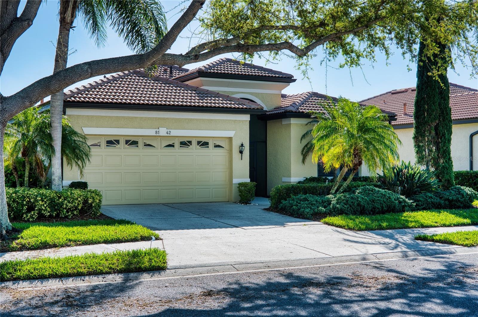 Price reduction on this Fabulous Lanai  home with a "secret garden" and looking out to a  pond. The Largest single family floor plan in Lakeridge falls! This 3 bedroom plus bonus den has plenty of space to entertain friends and family. New kitchen cabinets have been installed, to create an updated contemporary feel. This home is light and bright with additional solar tubes in the kitchen and den. Crown molding, under cabinet lights a screened front porch and a UV filter on the AC unit are just some of the additional things that make this home special. Lakeridge Falls is a 55+gated,  landscape maintained community with a clubhouse and pool that were renovated as well. Walk the neighborhood, or walk to Publix, Panera's and more, the location is perfect - A short ride to Downtown Sarasota, Lakewood Ranch Main Street, Lakewood Ranch Waterside, UTC Mall and everything around including the beautiful beaches we all love - Close to everything - But away from it all- and a perfect place to call home. With a full price offer, sellers will give a 15k credit at closing for a new roof when it needs it -