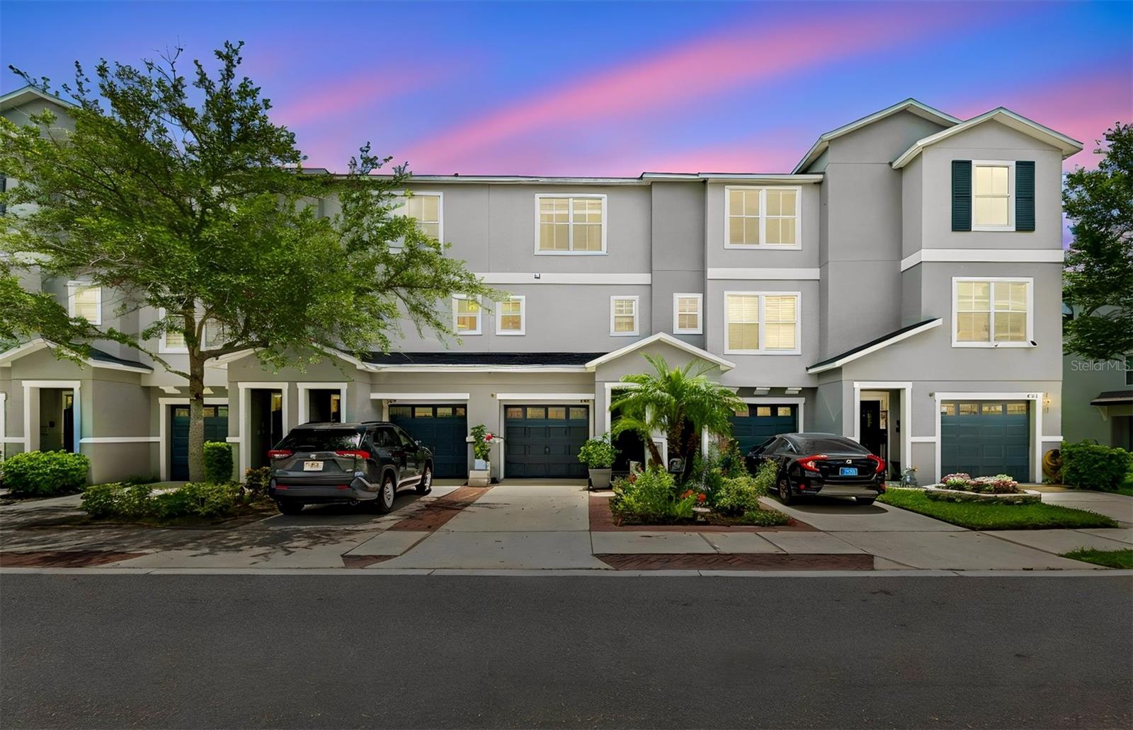 ATTENTION FIRST TIME HOMEBUYERS!!! Own a home in a gated waterfront community just 10 minutes from Downtown Tampa for under $300,000! Even better, this home qualifies for $3,000 CASH BACK at closing, making homeownership well within reach! Welcome to 4755 Tuscan Loon Drive, where peaceful pond views, low-maintenance living, and an unbeatable location come together. This beautifully maintained three-story townhome welcomes you with charming curb appeal, lush landscaping, and an inviting exterior. The entire first floor is dedicated to an oversized two-car garage, offering plenty of room for vehicles, storage, and all your weekend toys. Upstairs, you'll love the open concept living area with beautiful bamboo flooring throughout. The spacious kitchen features abundant cabinetry and overlooks the dining and living spaces, creating a seamless flow. Just off the living room, step onto your private balcony and unwind while taking in peaceful pond views—the perfect spot to enjoy your morning coffee or relax at the end of the day. A convenient powder room completes the main living level. On the third floor, you'll find brand-new carpet. The primary suite features dual closets and a private en-suite bathroom. The second bedroom also enjoys its own en-suite bath, offering privacy and comfort for guests, roommates, or family members. A spacious laundry room with a newer washer and dryer adds convenience and storage. You'll have peace of mind knowing the major systems have already been updated, including a new roof (2023) and HVAC system (2021). Beyond your front door, enjoy community amenities including a private dock with kayak launch and a sparkling community pool. The low HOA fee of just $350/month includes your internet, cable, water, sewer, trash, exterior maintenance, grounds maintenance and more! Location is everything—and this home delivers. You're just 10 minutes from Downtown Tampa and Ybor City, with quick access to shopping, dining, entertainment, major highways, and exciting nearby developments that could help boost property values. Whether you're buying your first home, downsizing, or looking for a low-maintenance lifestyle in a prime Tampa location, 4755 Tuscan Loon Drive is an incredible opportunity you won't want to miss. Schedule your private showing today before this one is gone!