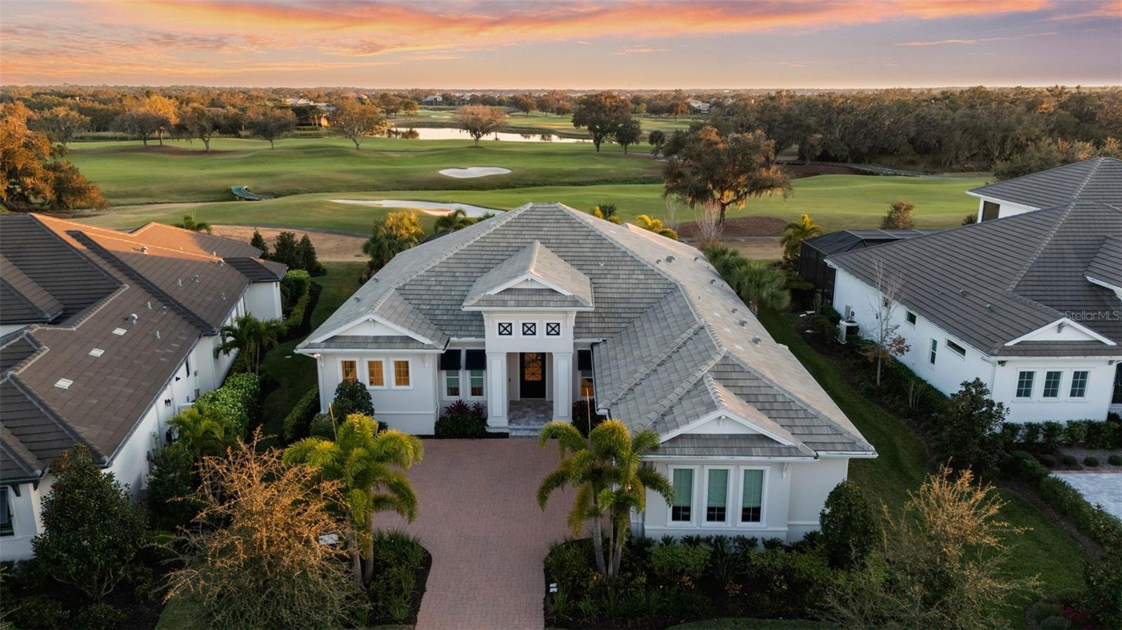 Under contract-accepting backup offers. Experience the pinnacle of Sarasota luxury in this professionally designed Lee Wetherington estate within the gated enclave of The Founders Club. Perfectly situated with breathtaking golf course views of the tenth hole, this residence serves as the benchmark for country club living. The meticulously curated interior is a showcase of high-end finishes, featuring hand-selected designer wallpaper, architectural shiplap, & reclaimed wood accents throughout.

The versatile floor plan is highly optimized for modern lifestyles, boasting a dedicated private office for the executive professional and an expansive bonus/media room ideal for hosting or relaxation. This masterfully composed home flows effortlessly to a massive outdoor oasis with Diana Marble decking and a heated saltwater pool.

The gourmet kitchen is a chef’s dream, appointed with a Fulgor natural gas cooktop, integrated GE Monogram refrigeration, and a designer bar with Cambria quartz and a wine cooler. The primary wing offers a private sanctuary with motorized shades, custom-outfitted walk-in closets, and a spa-bath with illuminated Kohler cabinetry. From the custom linen window treatments to the EV charger, every detail of this professionally designed home has been elevated. Enjoy a short walk to clubhouse amenities in one of Sarasota’s premier golf communities.