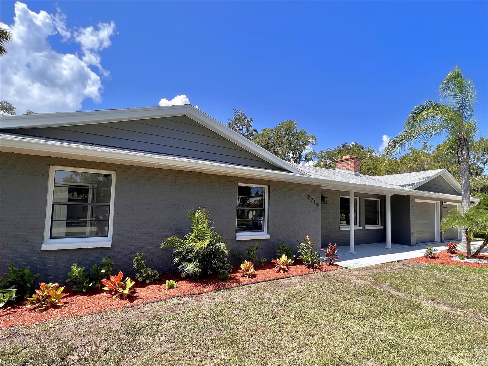 Welcome to your newly remodeled home at 2716 Kumquat on an oversized fenced-in lot! Have peace of mind knowing that your major components are new in 2023; including roof, AC, and all new appliances. Upon your approach to the property you will notice new tropical landscaping complete with irrigation, a covered entryway, and a fresh coat of paint. Inside you will find modern finishes such as luxury vinyl wood-look flooring, new baseboards, fans, light fixtures, and a beautiful kitchen with new cabinets and granite countertops. Both the primary bedroom en-suite and the guest bath have new vanities, tiled tubs and fixtures. For the garage lovers, revel in the two bay doors with new motors, newly painted walls and floors, and two enclosed rooms. Bring all the toys in this HOA-free community and take advantage of the triple lot for all your backyard dreams. ;Water: City