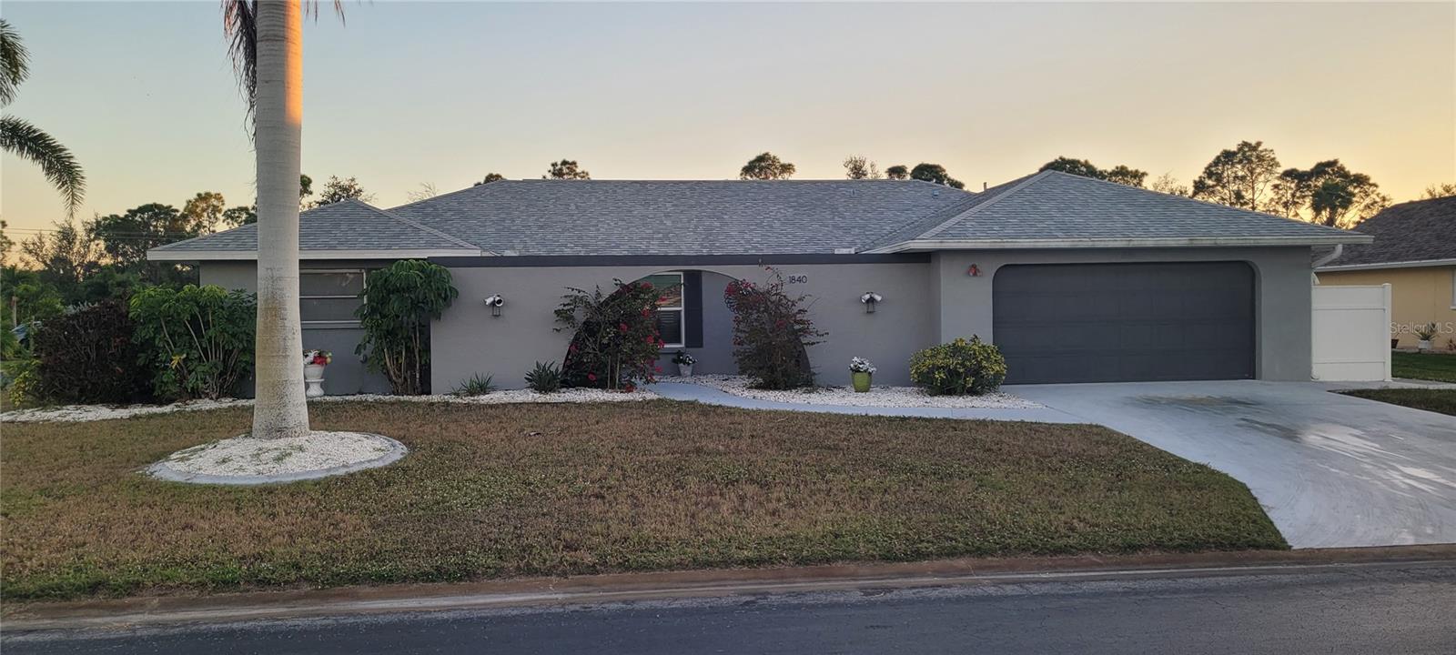 Jacaranda West fully remodeled home (2021) with golf & tennis community access and low HOA approx. $40/month. Features new roof, new
appliances, updated kitchen and baths, and extensive smart-home automation controlling lighting, curtains, pool pump, sprinklers, lanai misting
system, and keyless Bluetooth entry. The finished garage IN-LAW SUITE offers a private entrance, full kitchen, bathroom with shower, laundry,
and added interior/exterior storage. The main kitchen includes a pot filler, RO system, appliance lift, media hub, and integrated touchscreen
control center with Wi-Fi, Bluetooth, cameras, and quiet built-in ventilation. Primary suite showcases full-height tile, 5’x5’ walk-in shower with
thermostatic valve, bidet, freestanding tub, Bluetooth ceiling speakers, and walk-in closet with direct laundry access. Outdoor living features a
freestanding kitchen with refrigerator and Wi-Fi grill. Most furniture included (excluding lanai)