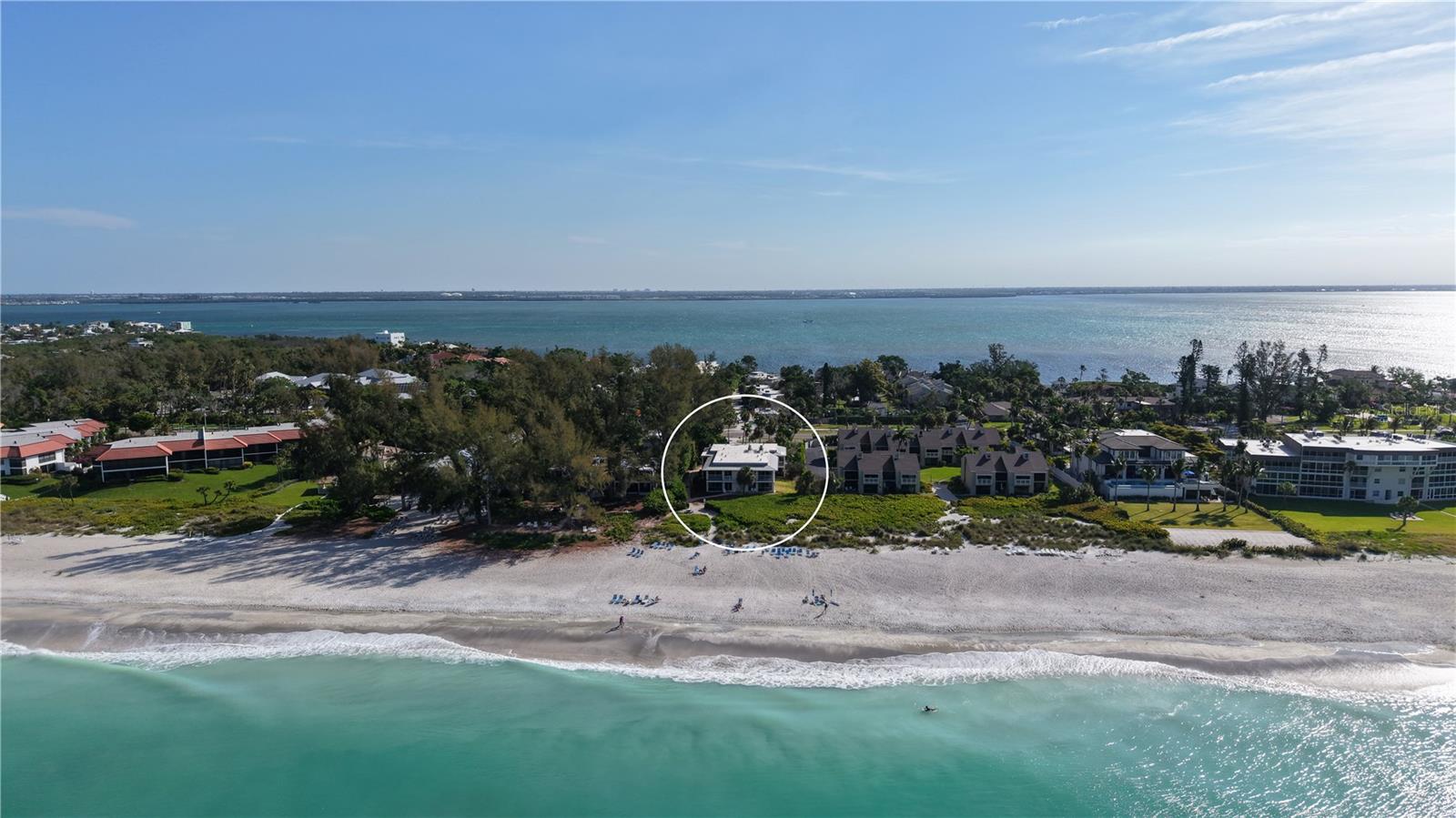 Turnkey furnished and positioned just steps from the Gulf’s sandy shoreline, this first-floor residence at Beach Castle on Longboat Key offers a compelling combination of coastal living and proven rental potential. With flexible daily or weekly rental allowances, this two-bedroom retreat presents an exceptional opportunity for personal use, income generation, or both. 
The light-filled interior features an open layout designed for ease and comfort, where the kitchen, dining, and living areas flow together naturally. Oversized tile flooring, updated impact glass, and sliding doors enhance both durability and livability, while the kitchen is well-appointed with granite countertops, solid wood cabinetry, stainless steel appliances, and built-in shelving—creating a functional space for everyday living or hosting. 
Floor-to-ceiling sliders lead to a private patio and screened lanai, offering a seamless transition to the outdoors and placing you just moments from the beach. The split-bedroom plan provides added privacy, with the primary suite enjoying direct access to the outdoor space, while the guest bedroom is comfortably sized with its own en-suite bath.
Set within the boutique Beach Castle community, residents enjoy a unique beach-to-bay lifestyle with deeded Gulf access, a heated swimming pool and spa, grilling areas, and a fishing pier with day dock on Sarasota Bay. Lush landscaping and well-maintained grounds create a relaxed, resort-style setting that enhances both owner enjoyment and guest appeal. 
Located on the desirable north end of Longboat Key, this property is just minutes from Bayfront Park, Cedars Tennis Resort, and the island’s scenic biking and walking paths. A short drive south brings you to the Longboat Key Club, St. Armands Circle’s dining and boutiques, and downtown Sarasota’s renowned cultural venues, waterfront parks, and year-round events.
With strong rental history, immediate beach access, and a turnkey presentation, this Beach Castle residence offers a rare opportunity to enjoy the best of Longboat Key—whether as an investment, a private getaway, or a combination of both.