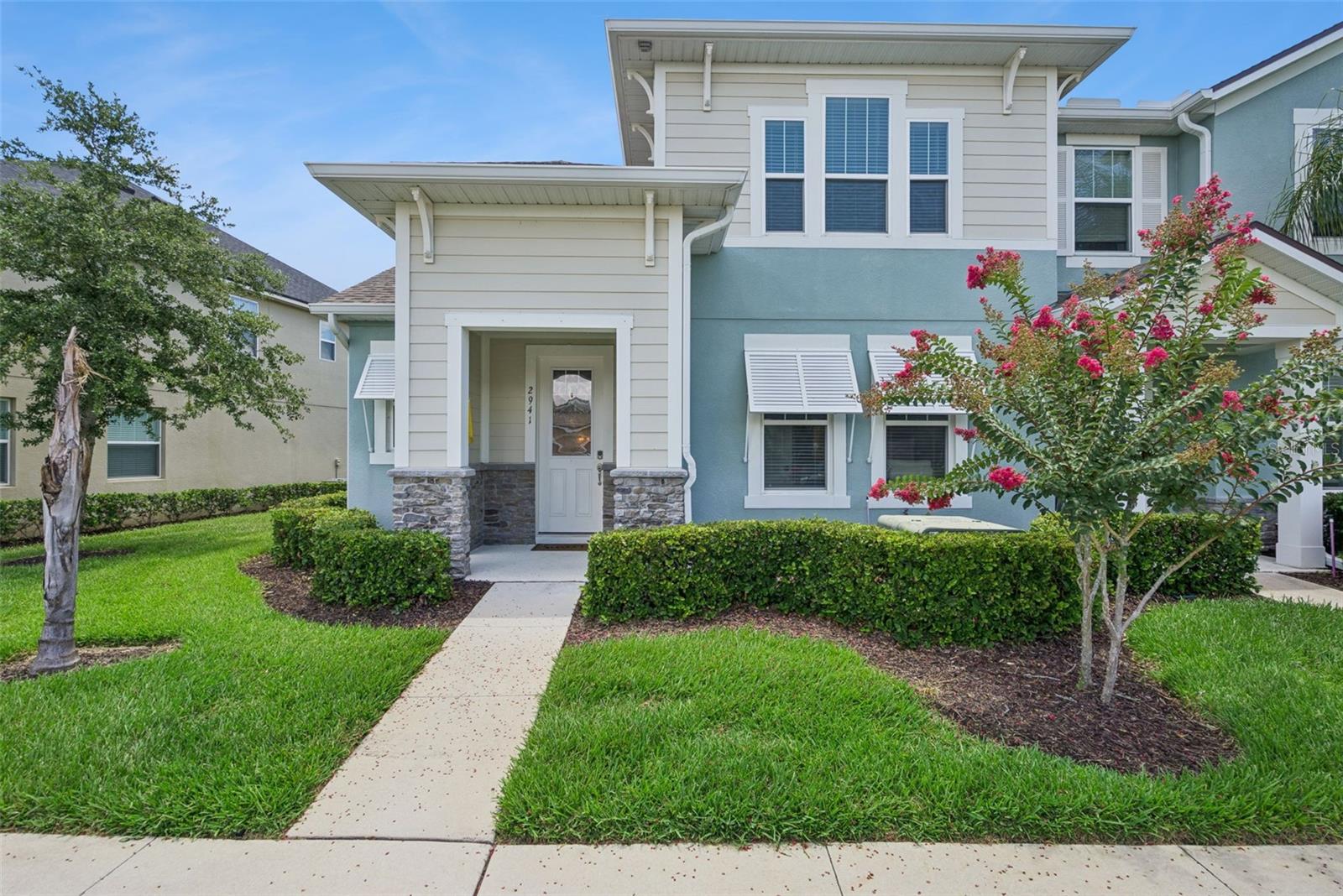 Move-in ready and beautifully upgraded, this 3-bedroom, 2.5-bath townhome offers 1,666 sq. ft. of comfortable living in the highly sought-after Waterbrooke community. Step inside to a spacious open floor plan that effortlessly connects the living room, kitchen, and dining area, creating a welcoming space for gathering and entertaining. The kitchen features granite countertops, stainless steel appliances, a farmhouse sink with reverse osmosis system, tile backsplash, and cabinetry accented with crown molding. Tile flooring throughout the main living areas provides both style and easy maintenance, while a convenient half bath is located downstairs for guests. The spacious first-floor primary suite offers a private retreat with an upgraded en suite bath featuring a double vanity, garden tub, walk-in shower, and a walk-in closet with custom built-in organizers. Upstairs, you'll find two additional bedrooms, a full bath, and a versatile loft that provides valuable flex space for a home office, media room, play area, or fitness space. Enjoy Florida living year-round from the screened lanai. Residents of Waterbrooke enjoy exceptional amenities including a clubhouse, resort-style pool, fitness center, playground, walking trails, and dog park. Conveniently located near shopping, dining, and major roadways with easy access to the Florida Turnpike, this home combines comfort, convenience, and an outstanding community lifestyle. Come see it today before it's gone!