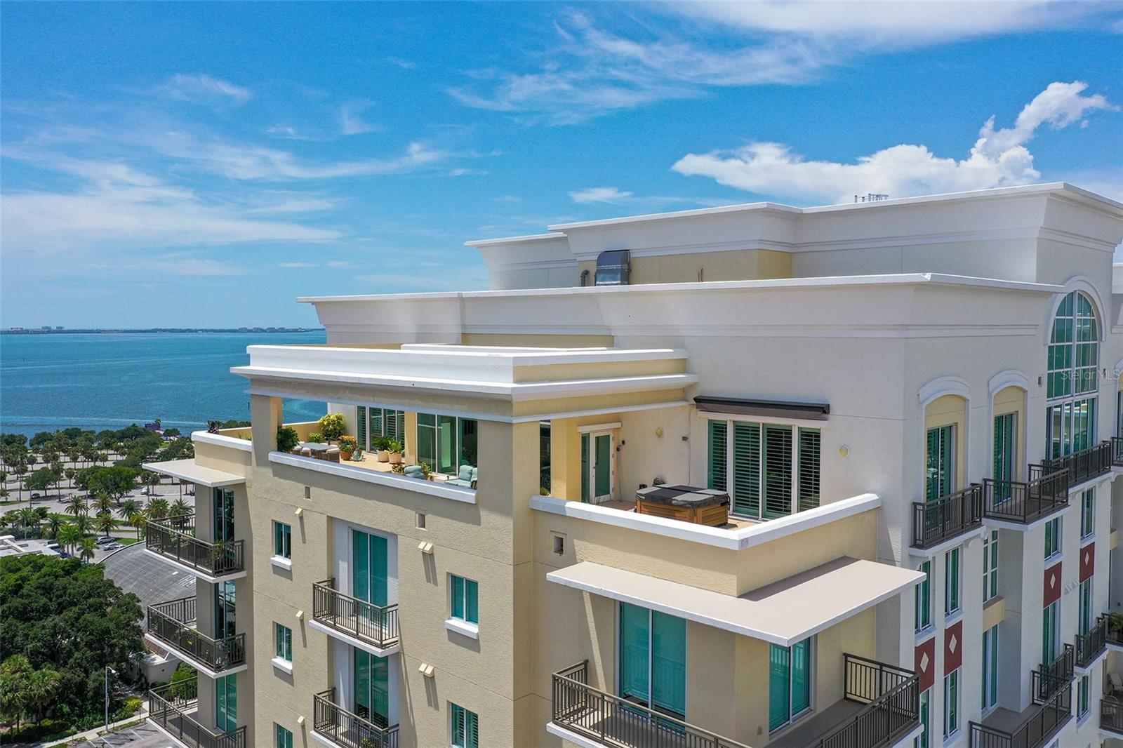 This unique 18th floor Alinari Penthouse with a 1500 sq. ft. roof deck is now available for one lucky family. To the West, unlimited views of the Bay and Gulf facing The Bay Park. To the East, downtown city views. This home in the sky features three bedrooms, three and a half baths plus den of elegant living in 3,219 sq. ft. Recently updated throughout, the chef’s kitchen has an LG gas stove, stainless appliances, quartz countertops, luxury wood cabinets, pantry, TV nook and large breakfast bar overlooking the roof deck. The roof deck has a grill and is the perfect space for entertaining and watching the fireworks. It even has retractable sunshades and a doggie door if desired. In the living area are windows facing incredible water views with electric shades to control the afternoon sun. An elegant alcove bar unites the open living/dining area and kitchen. The West facing primary bedroom has a seating area, two large closets with closet system and a spectacular ensuite bath with built-in vanity, new mirrors, light fixtures, and countertops. Add to that a soaking tub for total relaxation and a new glass shower stall with two heads. Glass tiles grace the walls and the interior of the tray ceiling. The whole house has solid wood doors, crown molding, wood-look plank tile flooring, plantation shutters and 2 new HVAC systems. Don’t forget the private cabana on the pool deck (one of only eight) and two parking spaces to make this the perfect choice for your new home. Alinari is an amenity-rich condominium with large 80 ft. long lap pool, hot tub, community grills, card room, party room with catering kitchen, sauna, wine storage, fitness center, office and conference rooms, 3 guest suites and movie theatre. The Alinari passed its structural inspection with flying colors. Located in the Rosemary District with restaurants and shopping nearby. The Bay Park is just across the street with the Van Wezal Performing Arts Hall, outdoor performance spaces, the Art Center, Welcome Center and Municipal Auditorium. Downtown and Lido Beach are a short distance away.
