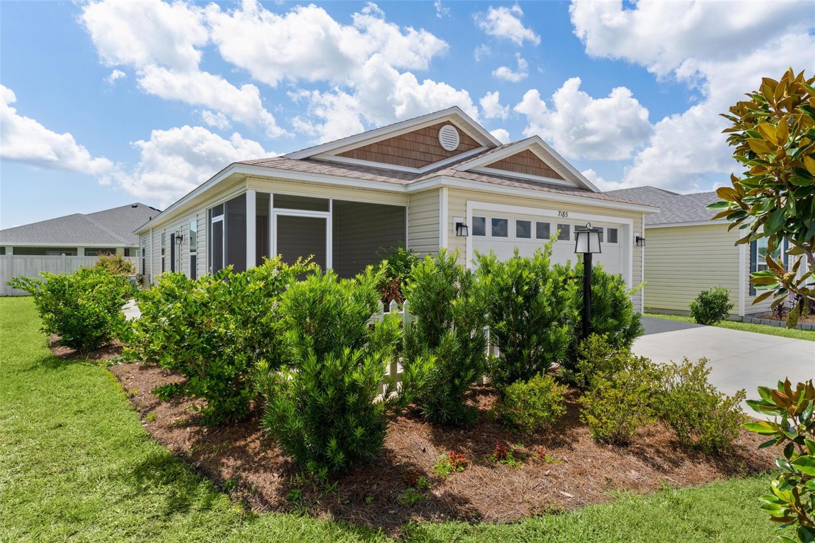 ~2023 ROOF, HVAC, & HOT WATER HEATER~ ~ROOM FOR POOL~  ~2 CAR GARAGE~
Welcome to this beautifully maintained TOPAZ Patio Villa in the friendly Village of NEWELLl! Charming curb appeal begins with classic picket fence and SCREENED LANAI, a perfect place to relax with your morning coffee or unwind after a day enjoying The Villages lifestyle. Step inside to discover soaring VAULTED ceilings and attractive laminate flooring throughout the main living areas, creating a bright and welcoming atmosphere. The spacious living room features a ceiling fan, and open layout that flows effortlessly into the kitchen and dining area. The well-appointed kitchen offers HI-DEF countertops, STAINLESS STEEL appliances, a GAS stove, and ample cabinetry, making it both stylish and functional for everyday living and entertaining. The private primary suite features plush carpeting, ceiling fan, and generous WALK-IN closet. The ensuite bath includes TILED WALK-IN shower and HI-DEF countertops for a clean, contemporary look. Guests will enjoy a comfortable bedroom with carpet, VAULTED ceilings, and BUILT-IN closet. The guest bath features TILED tub/shower combination and matching HI-DEF countertops. Take advantage of the attached 2-car garage, providing plenty of space for vehicles, storage, or your golf cart. Built in 2023, this like-new 2/2 home offers modern finishes, an OPOEN FLOOR PLAN and low-maintenance living, ideal as full-time residence, seasonal retreat, or investment property. This location has convenient access to recreation, golf, shopping, dining, and entertainment near SOUTHERN OAKS CHAMPIONSHIP GOLF, SAWGRASS GROVE, EZELL REGIONAL REC CENTER, HOMESTEAD & FRANKLIN REC CENTERS. Plus you're moments away from Magnolia Plaza, Lake Deaton Plaza, Brownwood Square and brand new EASTPORT.