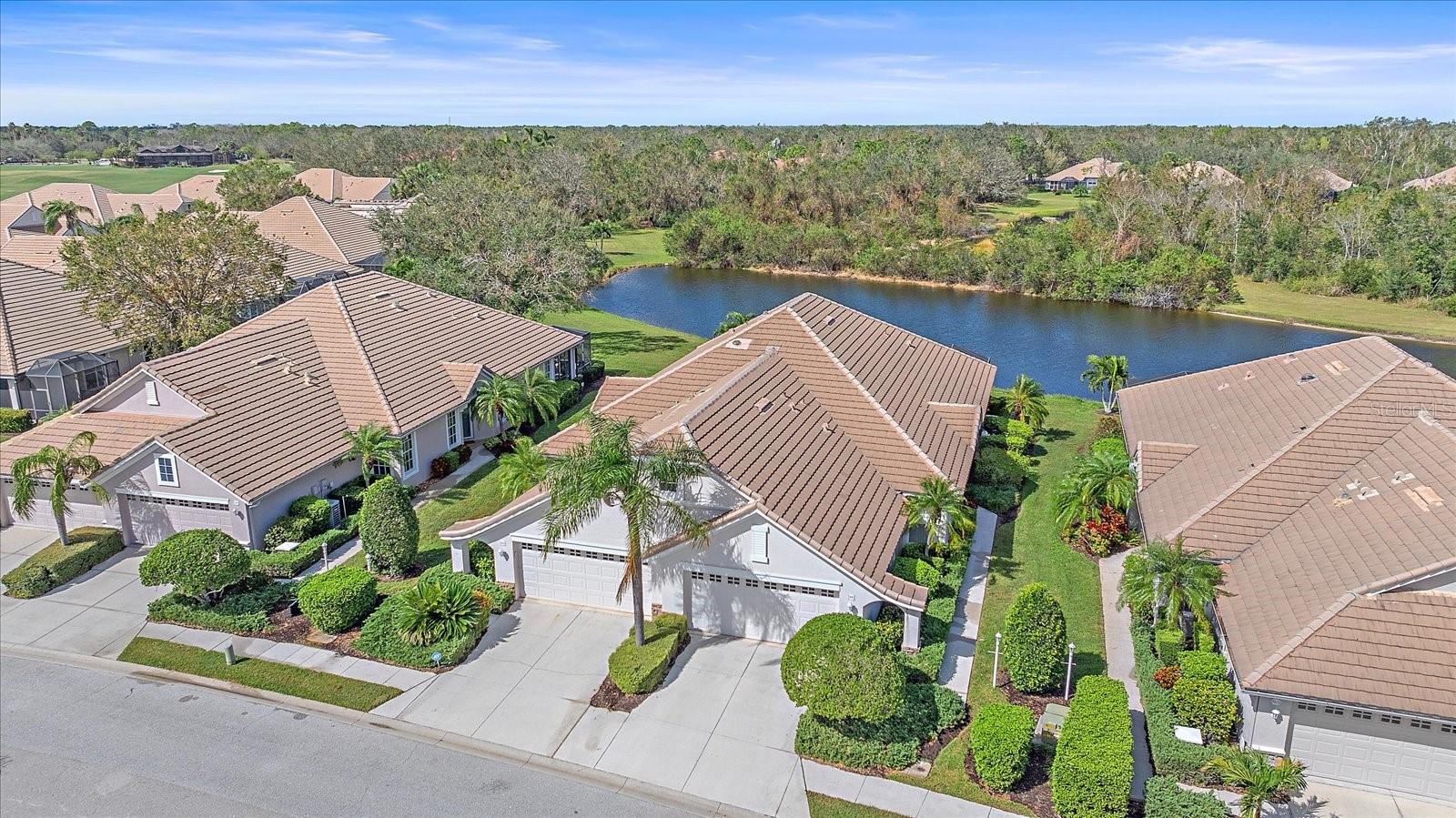 PRICE ADJUSTMENT!!!      The best value in Weston! An excellent opportunity to update and design according to your personal style. Welcome to 7011 Woodmore Terrace, a Maintenance-Free Lakewood Ranch Villa with a Private Preserve Setting. Enjoy easy Florida living. This villa is located in a quiet and welcoming neighborhood. Designed for comfort and convenience, this single-level home offers a relaxed lifestyle with spacious living areas and a functional layout perfect for everyday living. Spanning 1,565 square feet, this light-filled residence features an inviting open-concept floor plan. The kitchen has been thoughtfully updated with new granite countertops, sink, faucet, microwave, and a newer refrigerator (2019), creating a stylish and functional space at the heart of the home. Recent improvements also include a new gas water heater (2025) and re-stained bathroom tile flooring. The spacious primary suite offers a relaxing retreat with a generously sized bedroom and an en-suite bath featuring dual vanities. A versatile flex room provides the perfect option for a home office or den. The living and dining areas flow seamlessly, making gatherings both comfortable and welcoming. Step outside to your screened lanai overlooking the pond, an ideal spot for morning coffee or evening relaxation. The home is complemented by attractive landscaping, excellent curb appeal, and a 2-car garage.  One of the neighborhood’s standout features is the heated pool and spa located just steps away. This home offers a low HOA fee that covers landscape & irrigation, annual driveway, sidewalk, & roof cleaning, exterior painting as needed, cable TV, and internet. The Weston neighborhood offers an array of activities, including book clubs, Mahjong, Yoga, & Water aerobics at the community pool. While a golf membership is not included, optional memberships are available for an additional fee, offering access to four championship golf courses, 18 tennis courts, an Olympic-size pool, pickleball, a state-of-the-art fitness center, and 3 clubhouses with dining and social activities. Conveniently located minutes from Main Street shopping and dining, top-rated schools, and the world-famous Gulf Coast beaches, this villa delivers exceptional lifestyle and value. This is a rare opportunity to own in the Lakewood Ranch Country Club at the best price point available—don’t miss it.
