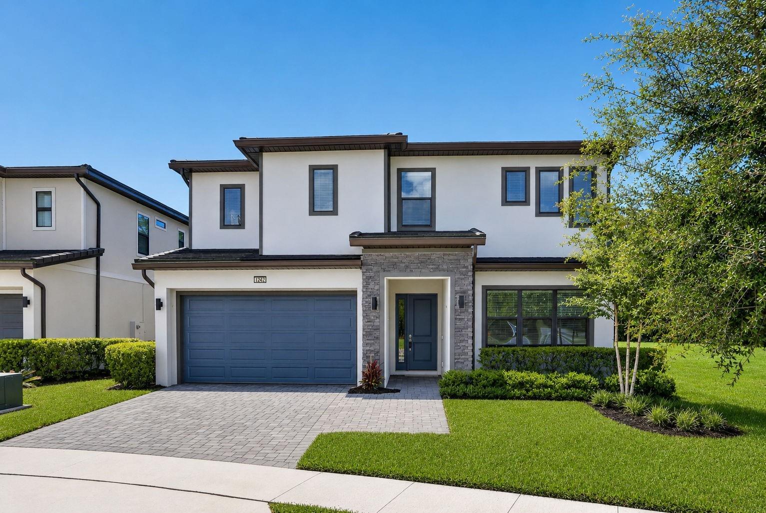 Luxury 12-Bedroom Short-Term Rental Opportunity Minutes from Disney – Zoned for 1-7 Day Leases in Guard-Gated Watersong Resort. Built in 2023 with 5,031 SF of heated living space, this two-story residence offers 12 bedrooms and 11.5 baths on a premium corner cul-de-sac lot with conservation on one side and no rear neighbors – rare privacy for a resort community. Offered unfurnished, the home is a blank canvas: design your own themed rooms and furnish to your brand standards, or make it your private multigenerational residence. The open floor plan features a chef's kitchen with double refrigerators, double dishwashers, double microwaves, and double sinks, built for large groups. First-floor primary suite plus an attached 1-bed/1-bath in-law suite. Outside, a screened private pool and spa with outdoor kitchen hookups anchor the entertaining space. Watersong amenities include a 24-hour guarded gate, clubhouse, resort-style community pool, and fitness center. Minutes to Disney, ChampionsGate golf and dining, and I-4, in one of Central Florida's most active vacation rental corridors. Flood Zone X. Highlights: 12 Bedrooms  11 Full Baths  1 Half Bath  Heated Private Pool & Spa  2023 Construction ,Corner Cul-de-Sac Lot with Conservation View, Short-Term Rental Zoning. Buyer or Buyer's agent shall independently verify all measurements, HOA restrictions, and short-term rental eligibility.