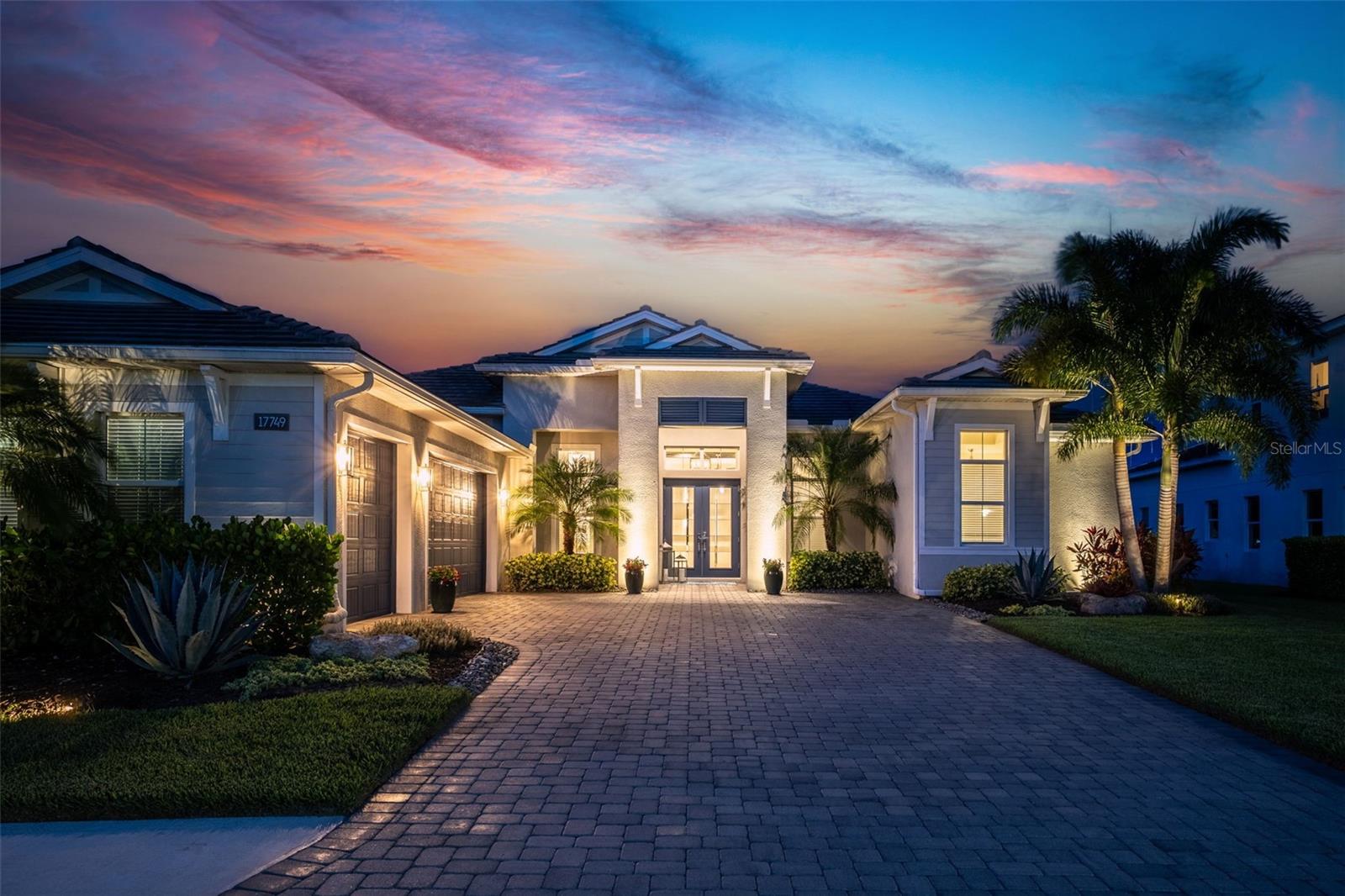 If you have been searching for a home that seamlessly blends coastal elegance with relaxed sophistication, this beautifully appointed residence is sure to impress. Privately situated on an exceptional homesite with tranquil water, conservation, and wildlife views, this 3-bedroom, 3.5-bath residence with a dedicated office offers a thoughtfully designed floor plan that balances luxurious living with everyday functionality.
 
Stylish indoor and outdoor living spaces are accentuated by soaring ceilings, creating an atmosphere of openness and refinement throughout. The heart of the home flows effortlessly to the lanai through 90-degree impact glass sliders, blurring the lines between indoors and out and making entertaining both effortless and inviting. The residence is further enhanced with hurricane impact windows/doors/sliders, The residence is further enhanced with hurricane impact windows/doors/sliders, as well as screens lowered at the push of a button, providing beauty, durability, and peace of mind. 
The outdoor retreat is designed for year-round enjoyment, featuring a newly added outdoor kitchen and a heated PebbleTec saltwater pool, all set against the backdrop of serene preserve and water views that invite you to relax and unwind while enjoying Florida’s natural beauty.
Privately positioned on its own wing, the owner’s retreat serves as a true sanctuary, complete with a luxurious spa-inspired bath featuring dual vanities, a soaking tub, and a walk-in shower. Two additional guest bedrooms offer spacious walk-in closets, including one en-suite bedroom that provides exceptional comfort and privacy. Just off the welcoming foyer, an impressive office with double-entry doors creates the ideal setting for working from home or pursuing personal interests.
Additional highlights include a water softener system, reverse osmosis system in the kitchen, and a three-car garage offering ample space for vehicles and storage.
Combining timeless style, exceptional upgrades, and a private natural setting, this remarkable residence offers the very best of Florida living. Schedule your private showing today and experience all that this extraordinary home has to offer.
Experience luxurious living in the gated, maintenance-free community of The Isles, nestled between The Lake Club and Concession. The Isles at Lakewood Ranch offers many amenities such as a 65,000 square foot clubhouse, tennis and pickleball courts, basketball court, playground, state of the art fitness center and yoga room, resort-style swimming pool and spa, boardwalk and fishing pier, and a playground and dog park. Centrally located, just off I-75 and a short drive to the award-winning beaches of Siesta Key, Lido, & Anna Maria. This move-in ready home has all the amenities that one would want in this 2025 Best-Selling Multigenerational Planned Community in the Nation.