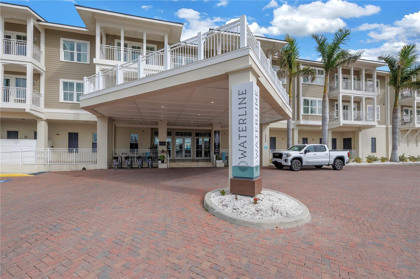 Experience the ultimate in resort-style living at Waterline Villas & Marina, nestled on the picturesque Holmes Beach of Anna Maria Island. This beautifully appointed corner unit with a highly sought after floor plan features a 2-bedroom, 2-bathroom condo that offers a seamless blend of coastal charm and modern sophistication. Enter through French doors into a welcoming hallway that leads you to the spacious guest bedroom, featuring two queen-sized beds and an ensuite bathroom. The inviting atmosphere is perfect for family or friends, with ample room and comfort.
As you continue through the unit, you'll be drawn to the heart of the home; the open-concept kitchen and living area. Warm wood accents throughout create a cozy, coastal ambiance. The living room offers a comfortable space to relax and unwind, with access to the expansive balcony overlooking the serene pool and canal.
The primary suite is a true retreat, complete with a king-sized bed and an ensuite bathroom for added privacy and convenience. Each area of the condo opens to the balcony, enhancing the indoor-outdoor living experience.
This prime location within the building offers views of the canal and intercoastal waters, setting the stage for memorable moments. Waterline Villas & Marina is not just a place to stay; it’s a destination. Enjoy resort-like amenities such as an on-site restaurant, fitness center, and a banquet room. For the water enthusiast, boat slips are available on a first-come, first-served basis, and bicycle rentals make exploring the island a breeze.
Part of Marriott's Autograph Collection, this unit benefits from professional management, ensuring a consistent revenue stream year after year. The unit is zoned to allow owners to occupy it for up to 120 days annually, providing a flexible ownership experience with the option to enjoy the property personally or generate income through nightly rentals.
With a strong rental history, prime location, and luxury amenities, this condo offers a unique opportunity for both personal enjoyment and investment. Don’t miss the chance to own a piece of paradise at Waterline Villas & Marina.
