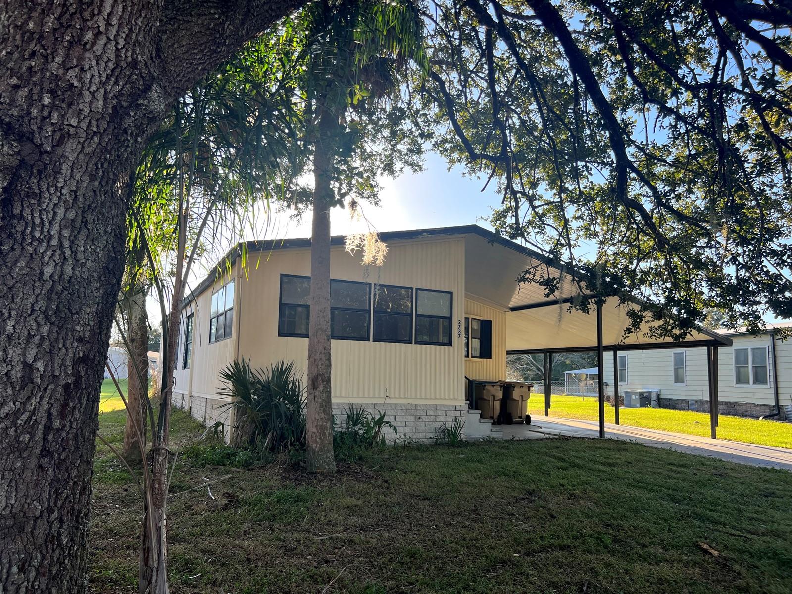 INVESTORS LOOK NO FURTHER! This Doublewide property offers 2 beds/2 baths with a FLORIDA ROOM. Just needs some TLC and then ready to go! Open concept home with covered parking and Laundry Room/Storage under roof. Home has lots of potential! Association amenities include Cable TV, Clubhouse, Park, Pickleball Courts, Playground, Pool, Recreation Facilities, and Tennis Court(s). Located in the peaceful and desirable subdivision of BROADMOOR. This KISSIMMEE home is approximately 20 minutes from DISNEY WORLD FLORIDA PARKS. Call today for your private showing.