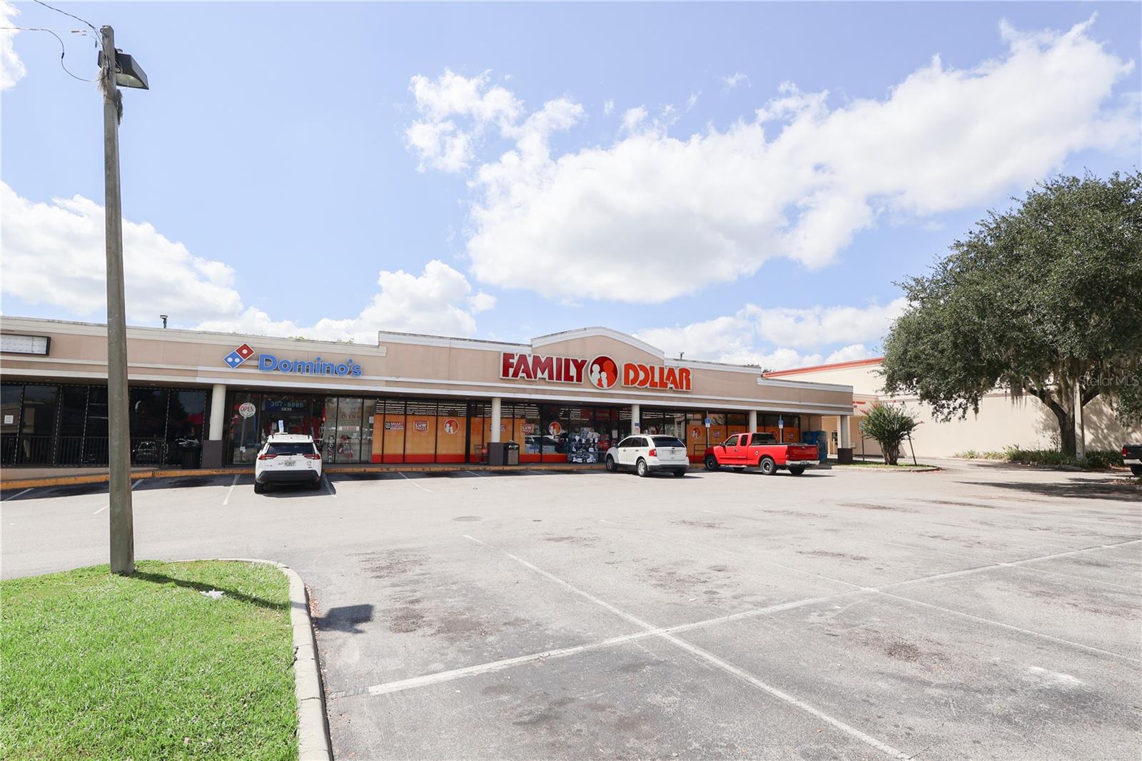 Own Belleview’s Best Corner and secure a premier investment opportunity in one of Central Florida’s fastest-growing corridors. This leased retail plaza offers over 20,000 SF of high-performing retail space with unbeatable frontage and daily traffic counts of 48,000 on Hwy 441/Pine Ave and 12,100 on Hames Rd. Anchored by nationally recognized tenants including Domino’s Pizza, Family Dollar, Napa Auto Parts, T-Mobile, and other established local businesses, the property provides immediate, steady income with long-term upside. Adding to its value, two vacant parcels are included in the sale, creating additional opportunities for build-to-suit development, ground lease opportunities, franchise expansion, drive-thru concepts, pad site development, specialty retail, or service-based tenants such as The UPS Store, Sport Clips, medical, wellness, or other national roadside tenants. Positioned across from national fast-food chains and major retailers, and benefiting from shared traffic with CVS and a neighboring oil change center, this site offers exceptional visibility, access, and customer draw. A proven retail destination since the 1960s, the property is strategically located near Hwy 301, I-75, Hwy 441, Hwy 27, The Villages, and Ocala. Opportunities like this are rare. Don’t miss the chance to own a prime corner property with immediate cash flow and future development potential. Rent roll available upon request.