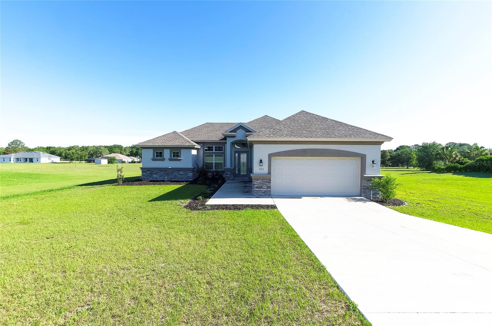 Welcome to this beautiful 3 bedroom 2 bath home Ct located in the highly desirable community of Citrus Hills in Hernando, FL! Built in 2022 and situated on a spacious 1 acre lot, this beautifully maintained 3 bedroom, 2 bathroom home offers the perfect blend of modern comfort and peaceful Florida living. Step inside to an open and inviting floor plan filled with natural light, high ceilings, and stylish finishes throughout. The spacious kitchen features modern appliances, ample cabinet space, and a large island overlooking the living and dining areas, making it perfect for entertaining or everyday living. The primary suite offers a relaxing retreat with a large walk in closet, dual vanities, and a beautifully designed walk in shower. The additional bedrooms are generously sized and ideal for family, guests, or a home office. Enjoy your mornings or evenings on the screened lanai overlooking the oversized backyard with plenty of room to add a pool, detached garage, or create your dream outdoor oasis. Additional features include a 2 car garage, indoor laundry room, and newer washer, dryer, refrigerator, dishwasher, and microwave included with the home. This home includes the mandatory Citrus Hills Golf & Country Club Social Membership, often referred to as the “Keys to the Kingdom,” giving residents access to an incredible lifestyle and resort style amenities throughout the community. Conveniently located near shopping, restaurants, golf courses, outdoor recreation, and the beautiful Nature Coast while still offering the peace and privacy of country style living. This move in ready home is one you do not want to miss!