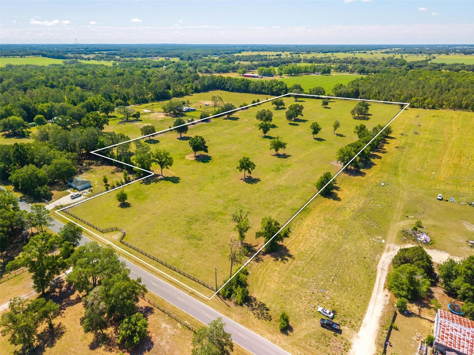 An exceptional offering of nearly 15.5 acres in Morriston, Florida, ideally positioned within the greater Ocala equestrian corridor and just a short drive to both HITS and the World Equestrian Center. This beautifully cleared parcel features established pasture with mature grass and a scattering of granddaddy oaks, creating a timeless, park-like setting with natural shade and character. Fully perimeter fenced, the property is ideally suited for immediate equestrian use, including turnout, retirement, or raising young horses. With its expansive, usable layout and premier location, this is a rare opportunity to create a bespoke farm or private estate in one of Central Florida’s most sought-after horse communities.

Also available: Adjacent 10 acre farm (MLS ID OM724058), offering a rare opportunity to expand and create a larger-scale equestrian estate.