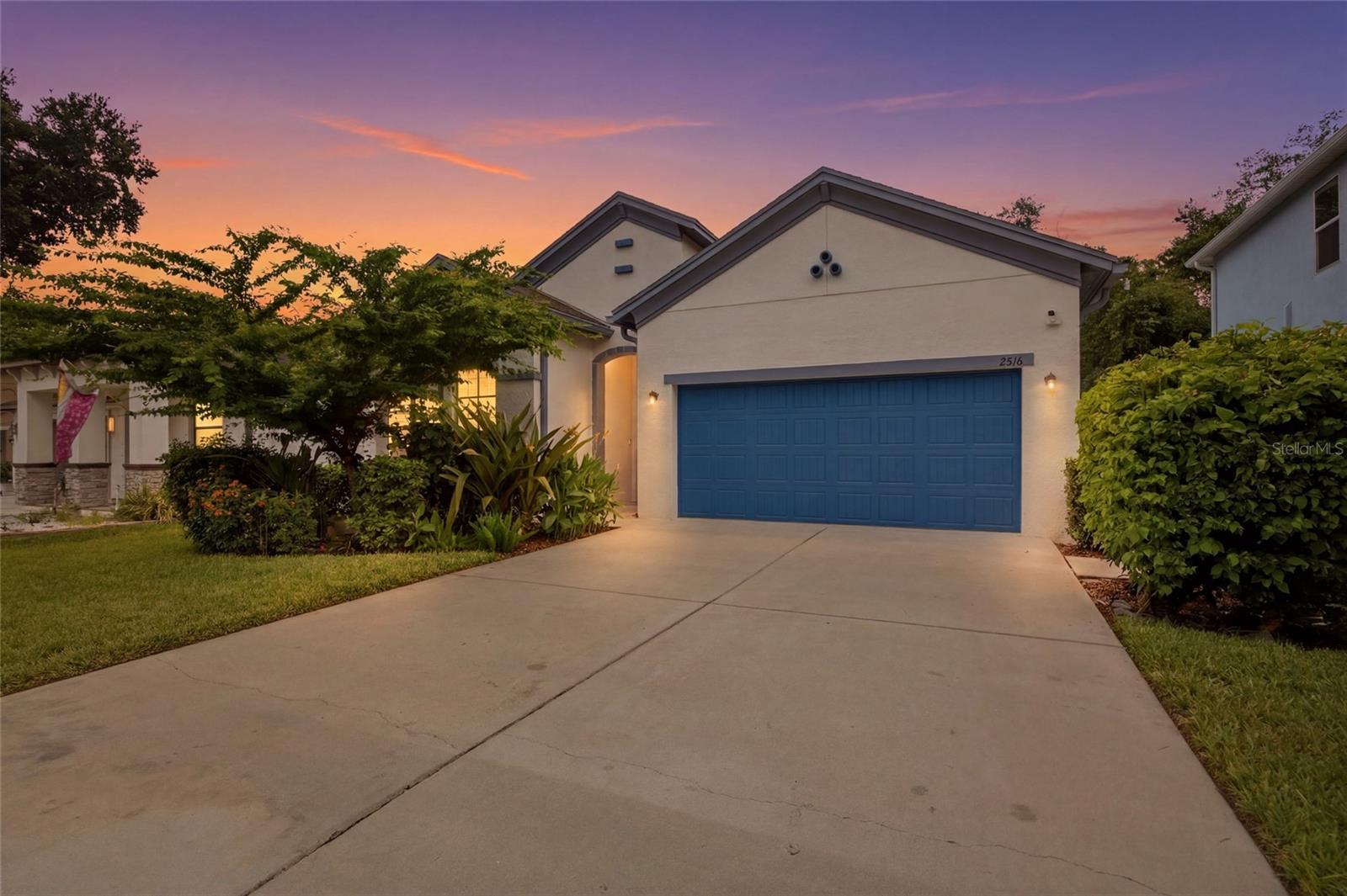 Experience elevated living in this exceptional 2019-built residence, where timeless style meets modern comfort. Perfectly situated on a quarter-acre lot, this move-in ready home features soaring ceilings, wood-look tile flooring, and a bright open-concept layout designed for both everyday living and entertaining. A private flex room behind French doors welcomes endless possibilities as a home office, study, media room, or formal sitting area. At the heart of the home, the designer kitchen is crafted to impress with gleaming granite countertops, a stunning shiplap-accented center island, upgraded cabinetry with crown molding, stylish backsplash, stainless steel appliances, a decorative glass pantry door, and an oversized walk-in pantry. The dining area flows seamlessly into the spacious great room, with sliding glass doors leading to a covered lanai and a huge backyard offering the perfect setting for outdoor gatherings and relaxation. The luxurious owner's suite serves as a peaceful escape, highlighted by elegant tray ceilings, an oversized walk-in closet, and a spa-inspired ensuite featuring a soaking tub, dual vanities, and a frame-less glass shower. Two additional bedrooms and bathrooms provide generous accommodations for family, guests, or flexible living needs. The home also includes a laundry room with washer/dryer, two-car garage, and a two-car width, two-car deep driveway with basketball hoop. Enjoy refined Florida living without the restrictions of an HOA or the added expense of CDD fees in one of Tampa's most convenient locations, with quick access to Downtown Tampa, Tampa International Airport, Raymond James Stadium, premier healthcare facilities, major highways, shopping, dining, and recreation in a no flood, no evacuation zone. Come check it out and take advantage of the opportunity to make it your own! *Disclaimer: While all information is deemed to be reliable, buyer is responsible for performing their own due diligence and confirming the accuracy of all information. Make your appointment today!