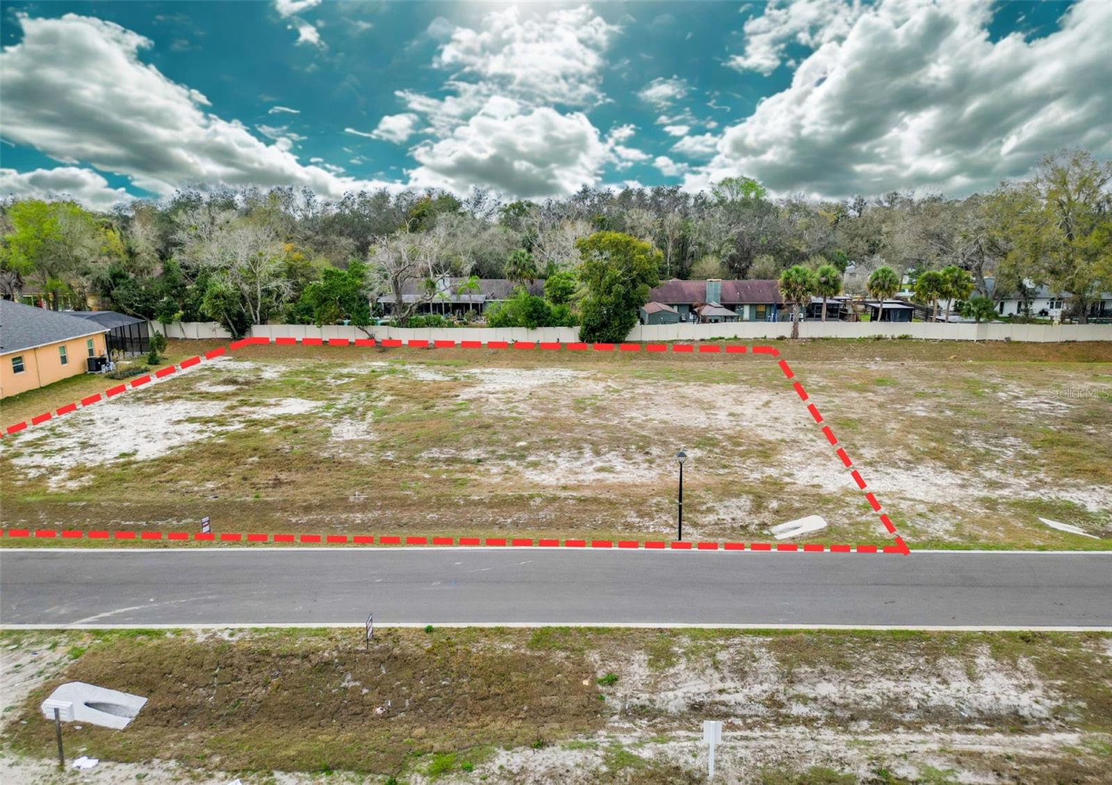 Land development is complete. Nestled in the charming and established Lutz neighborhood, this private enclave, Sunset Estates, features only eight meticulously designed residential lots, ensuring an intimate living experience. Three exquisite homes have already been sold and built, and five prime lots remain available for discerning buyers. To keep the architectural charm and overall aesthetic of Sunset Estates intact, all designs and lot configurations need developer approval. Nestled in the desirable Flood Zone X, you can rest easy knowing flood insurance isn’t necessary. Plus, Sunset Estates is situated within the acclaimed Lutz school district and is only moments away from a selection of high-end dining, boutique shops, local parks, and other fantastic amenities. The accompanying photos showcase the lot, community, and other homes within the development.