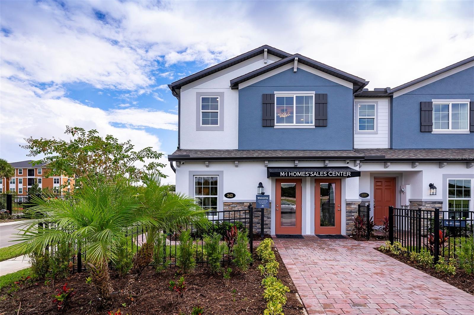 MODEL HOME WITH LEASEBACK! At 1,769 square feet, this end-unit townhome features 4 beds, 3 baths, and a 1-car garage with a 2-car-wide driveway. Enjoy the extra privacy, additional outdoor living space, and flexibility similar to a single family home. The natural light from the side windows leaves the inside light, bright, and cheery. The front door is located down a private walkway on the side of the home. Inside, the kitchen flows effortlessly into the great room, which also delivers a generous dining space. You’ll love the stone accent wall and the upgraded lighting fixtures. Storage won’t be a problem in the L-shaped kitchen with its pantry and 42” white cabinets. Wood-look tile flows throughout the entire first floor and the wet areas upstairs. The downstairs bedroom will make a perfect guest room or home office and is complete with an adjacent full bath. The screened lanai, which showcases Florida glass for privacy, is a great spot to enjoy the beautiful weather. Head upstairs and be greeted by a loft, which makes a great second hangout area. A linen closet and laundry hook-ups are centrally located for convenience. 2 secondary bedrooms and a full bathroom are in the back of the home, while a large owner’s retreat can be found in the front. Here, you’ll enjoy a huge walk-in closet and en-suite bathroom with dual sinks, an oversized shower, and a linen closet. Learn more about the lease back terms of this 100% ENERGY STAR® 3.1 certified home today!