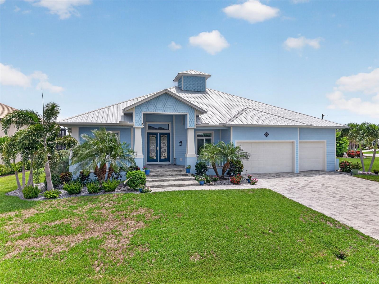 Punta Gorda Isles! Exquisite 3 bedroom + office/den, 3 bath, 3-car garage waterfront pool home with Sailboat access to Charlotte Harbor and the Gulf! This magnificent home has rich architectural details including high & double tray ceilings, crown molding, and contemporary lighting. The living room features a zero-corner slider to the lanai seamlessly blending indoor and outdoor living spaces. Adjacent to the living room, you'll find an office space that offers endless versatility, perfect for working from home, a private retreat, or even a library. Gourmet kitchen features Kitchen Aid appliances, two-toned wood cabinetry with under-cabinet lighting, beautifully complemented by a tile backsplash and quartz countertops. A gas cooktop, pot filler, farmhouse sink, and closet pantry enhance its functionality. The dining area is highlighted by a large sliding glass door that showcases serene water views, while the oversized island offers abundant seating and serves as the heart of the home for everyday living and entertaining. Generous primary suite offers direct access to the lanai/pool area and an ensuite bath with dual vanities featuring comfort-height counters, a beautiful frameless shower, and a private water closet. The ensuite also includes the flexibility to add a tub in the future, as a dedicated hookup and drain are already available. A spacious custom walk-in closet rounds out the suite, providing plenty of organized storage. Split floor plan is designed for optimal privacy, featuring two additional guest bedrooms, each with their own ensuite bath. One of the guest baths conveniently doubles as a pool bath, adding to the home's functionality and appeal. Step outside to your private oasis featuring a covered lanai, amazing outdoor gas grill area that is hardwired on propane and a privacy screened heated saltwater pool perfect for entertaining guests. Beyond the lanai, a path leads to your private dock, fully equipped with a 7,500 lb boat lift complete with water and electric. Additional features include pebble tech pool finish with a lifetime warranty, hurricane shutters for the zero-corner slider, insulated attic with pull-down stairs in hallway, garage workshop, and generator hookup. Located on a quiet street in a popular golf and boating community close to St. Andrews South Golf Club, the Yacht Club, Fishermen's Village, and the historic downtown area of Punta Gorda. Enjoy access to arts, community events, entertainment, world-class fishing, boating, fine dining, and beautiful parks, as well as easy access to the SWFL gulf beaches. Don't miss your chance to own this waterside treasure! Schedule your private showing today!