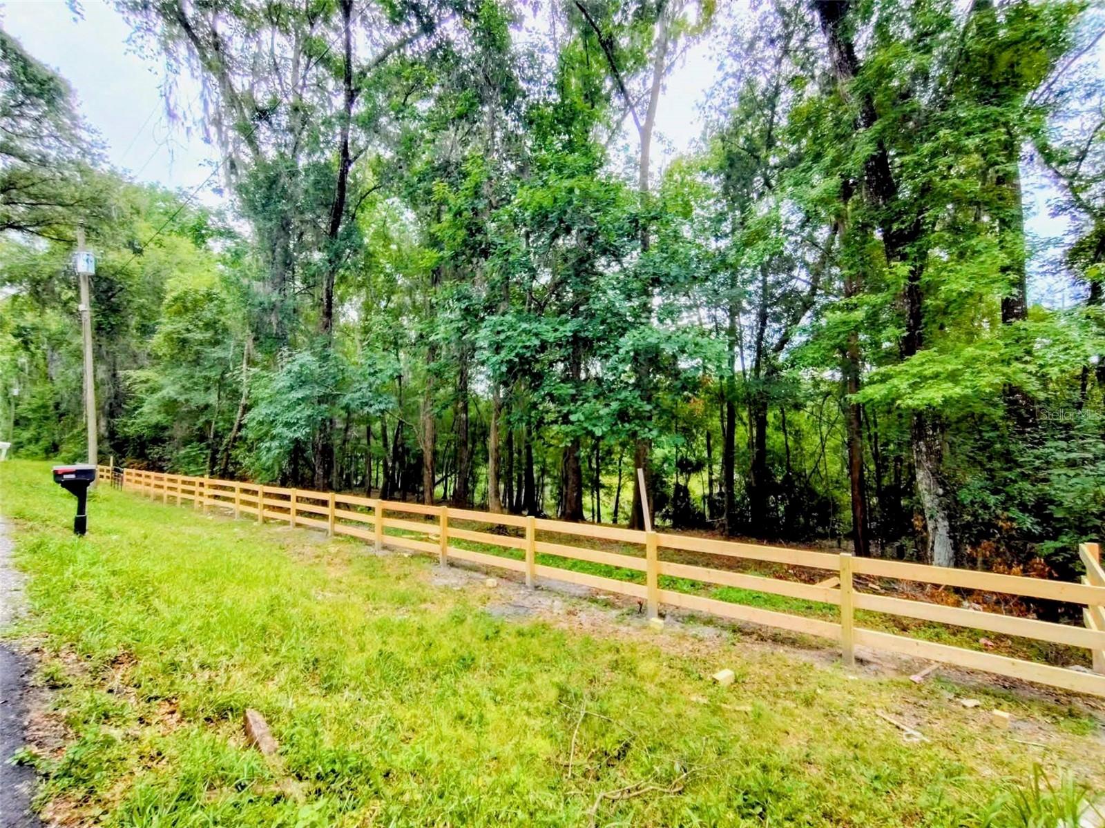 Build your dream home in beautiful Brooksville. Located in the peaceful rural Ludlow Heights area. This cleared and newly fenced residential lot offers privacy and a true country feel while remaining close to everyday conveniences. With no HOA, it’s an ideal setting for a custom home, modern farmhouse, or classic Florida retreat, with room for outdoor living and a spacious yard. The property is close to the  Brooksville Country Club and approximately 10 minutes to historic downtown Brooksville, known for its charming cobblestone streets, restaurants, and  shops. Outdoor activities are available with nearby parks and trails, including Croom Wildlife Management Area, offering miles of hiking, biking, and equestrian trails. Zoned R1C, allowing a single-family or modular home. Lot is being sold with the continuous parcel next door see MLS TB8517920.  When purchased together you will have a stunning cleared area of .60 acres. Note: photos include both parcels except first photo.