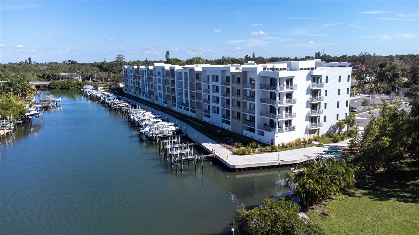 Step into this breathtaking, turnkey furnished one-bedroom plus den condo at The  Strand, where modern elegance meets the serenity of waterfront views. Built in 2022, this stunning residence is your gateway to the best of Sarasota, whether you're seeking a full-time home, a vacation retreat, or an exceptional investment opportunity. Perched less than a mile from downtown Sarasota, this condo offers unparalleled views of Sarasota Bay, perfect for enjoying dazzling sunsets and sparkling city lights. Inside, over $20,000 in designer furnishings blend sophistication with comfort. The open floor plan features luxury vinyl flooring, quartz countertops, sleek modern cabinetry, and stainless-steel appliances, creating an inviting space that radiates style and functionality. The Strand is more than a home—it's a lifestyle. This upscale waterfront community boasts world-class amenities, including: A resort-style heated pool and spa, A fully equipped fitness center, A dog park for your furry friends, A floating kayak dock, opening access to explore the serene bay and Gulf of Mexico, Conveniences like EV charging stations, a fire pit, and gas grills. This unit comes with an assigned covered parking space, ample guest parking, and a private storage closet, perfect for stowing beach and recreational gear. Weekly rentals are allowed, making it a fantastic investment opportunity for those seeking short-term rental income. Location is everything, and The Strand delivers! You’ll be just a short walk or bike ride to downtown Sarasota’s vibrant offerings, including: The Bay Front Park,  Sarasota’s famed restaurants, museums, and theaters, The lively Saturday farmers market and countless festivals. Within minutes, you’ll find the world-class shopping and dining of St. Armands Circle and the pristine sands of Lido Beach. A short drive takes you to the award-winning Siesta Key Beach, renowned for its powdery white sand. Don’t miss out! Whether you’re soaking in Sarasota’s arts scene, indulging in outdoor adventures, or simply enjoying the Bayfront views from your private balcony, this property truly has it all. Schedule your private tour today and make this exceptional condo your new home or investment. Call today for more details and to schedule your private tour. Seller offering to finance.